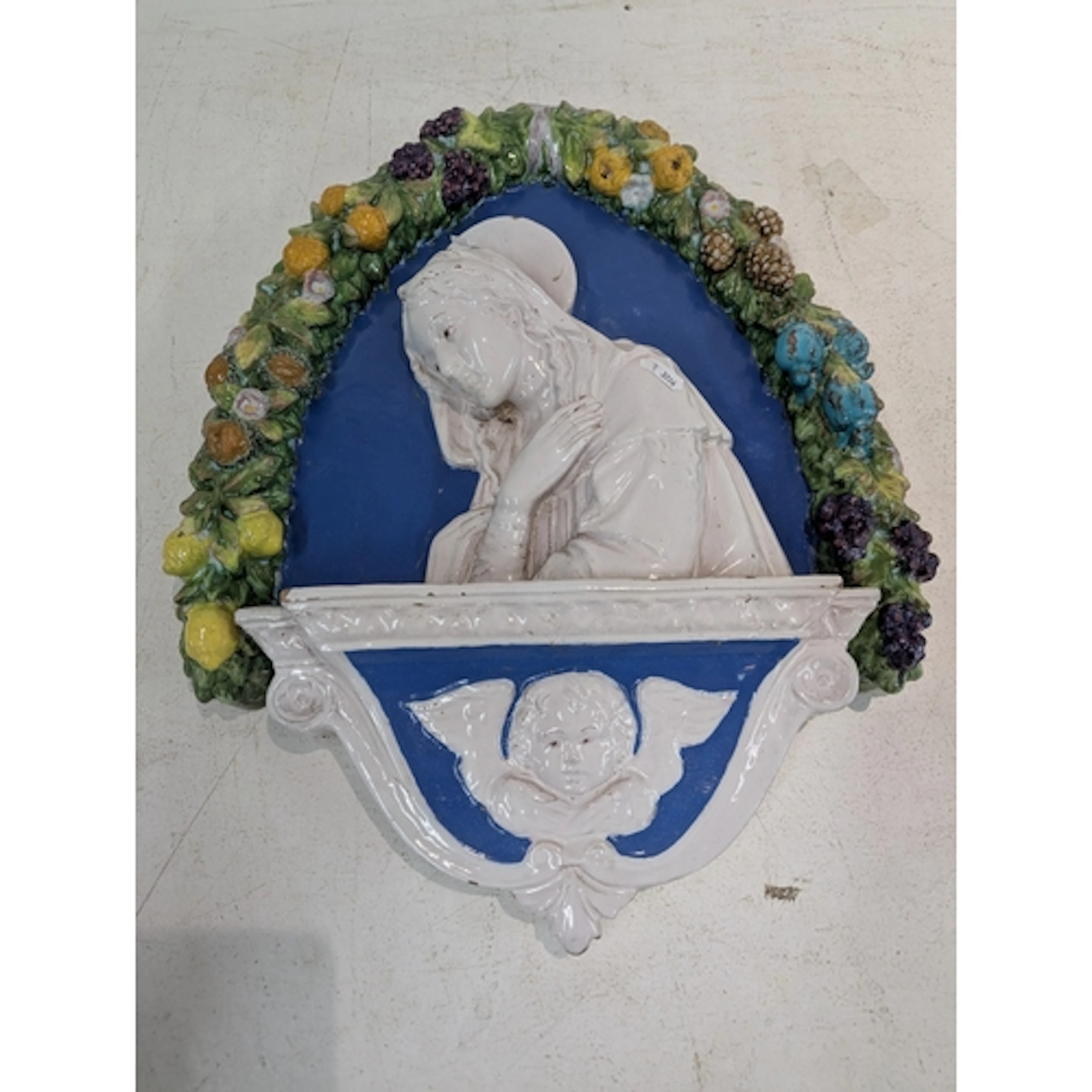 A Majolica glazed wall plaque designed in the renaissance st...