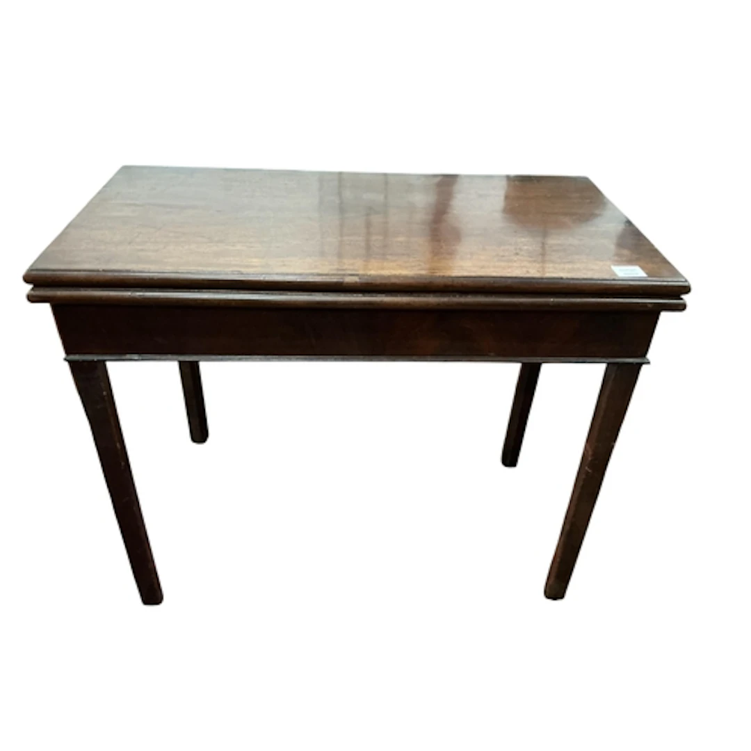 An early George III mahogany fold over tea table, width 90cm...