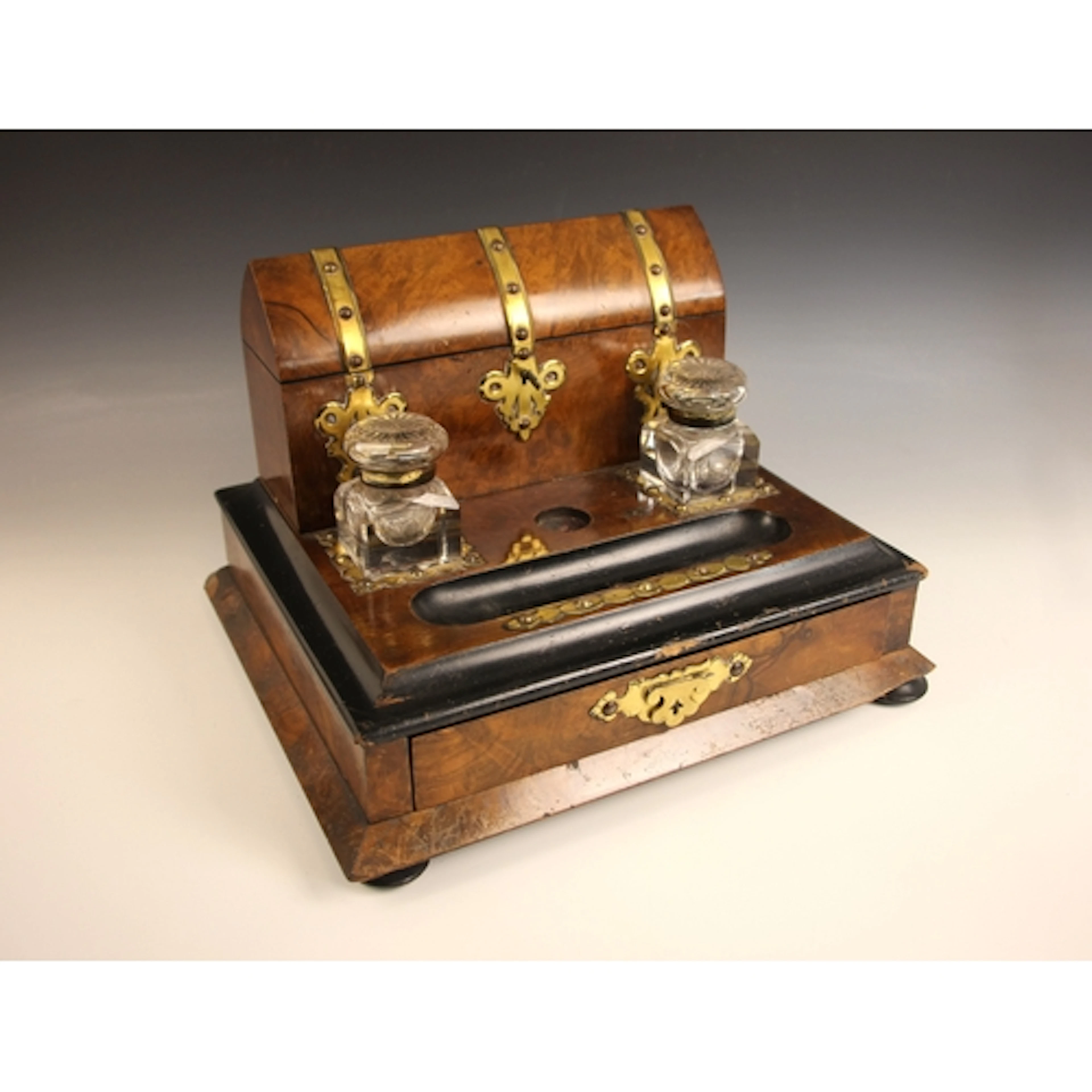 A Victorian Gothic Revival brass bound walnut and ebonised d...