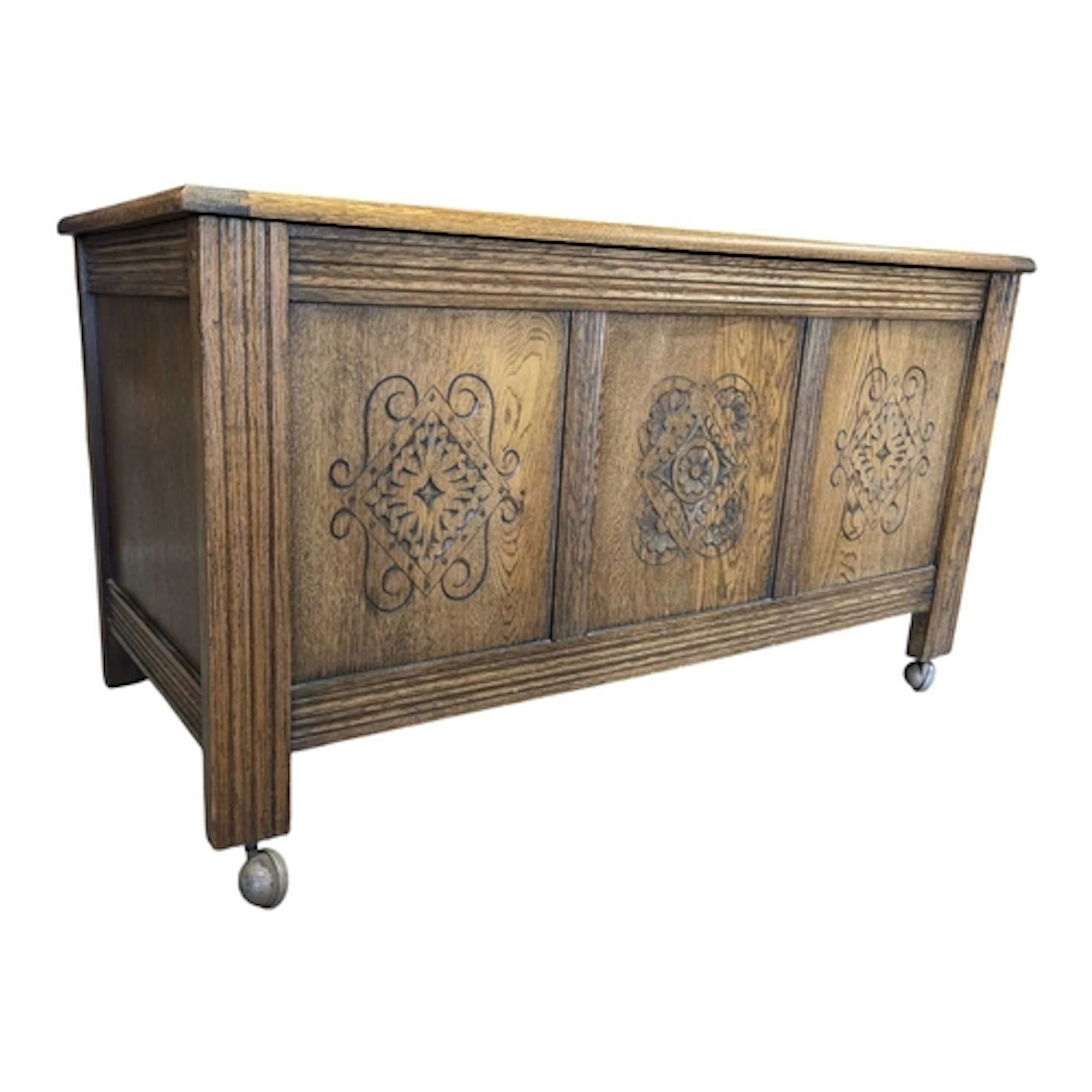 A Jacobean revival solid oak coffer chest. Raised on stile s...