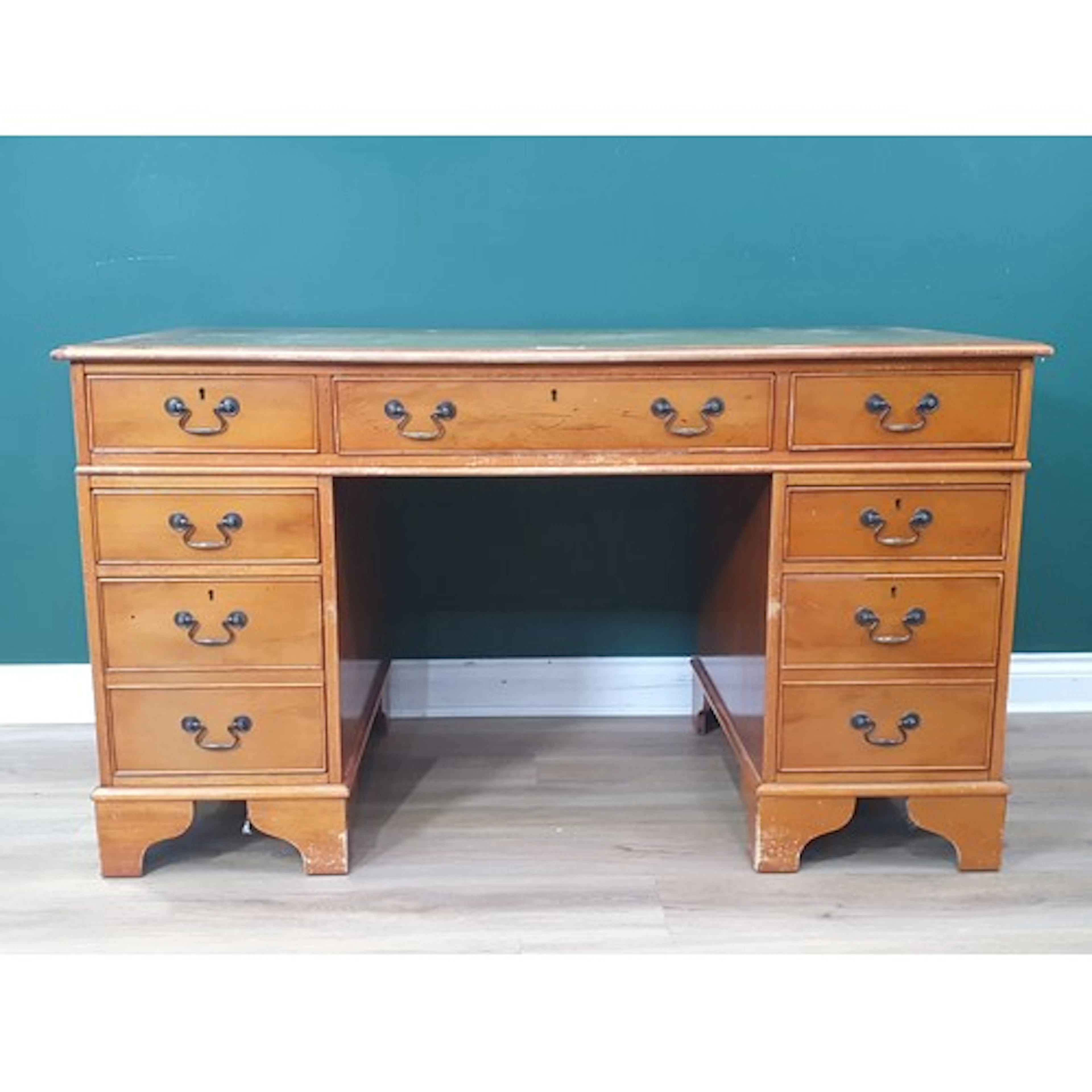 A reproduction yew wood veneered Pedestal Desk with leather ...