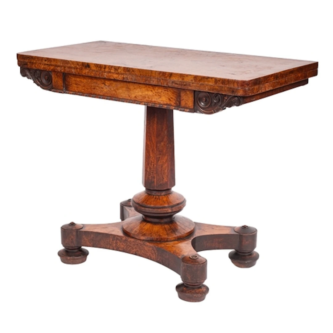 A Regency burr oak card table, early 19th century; the revol...