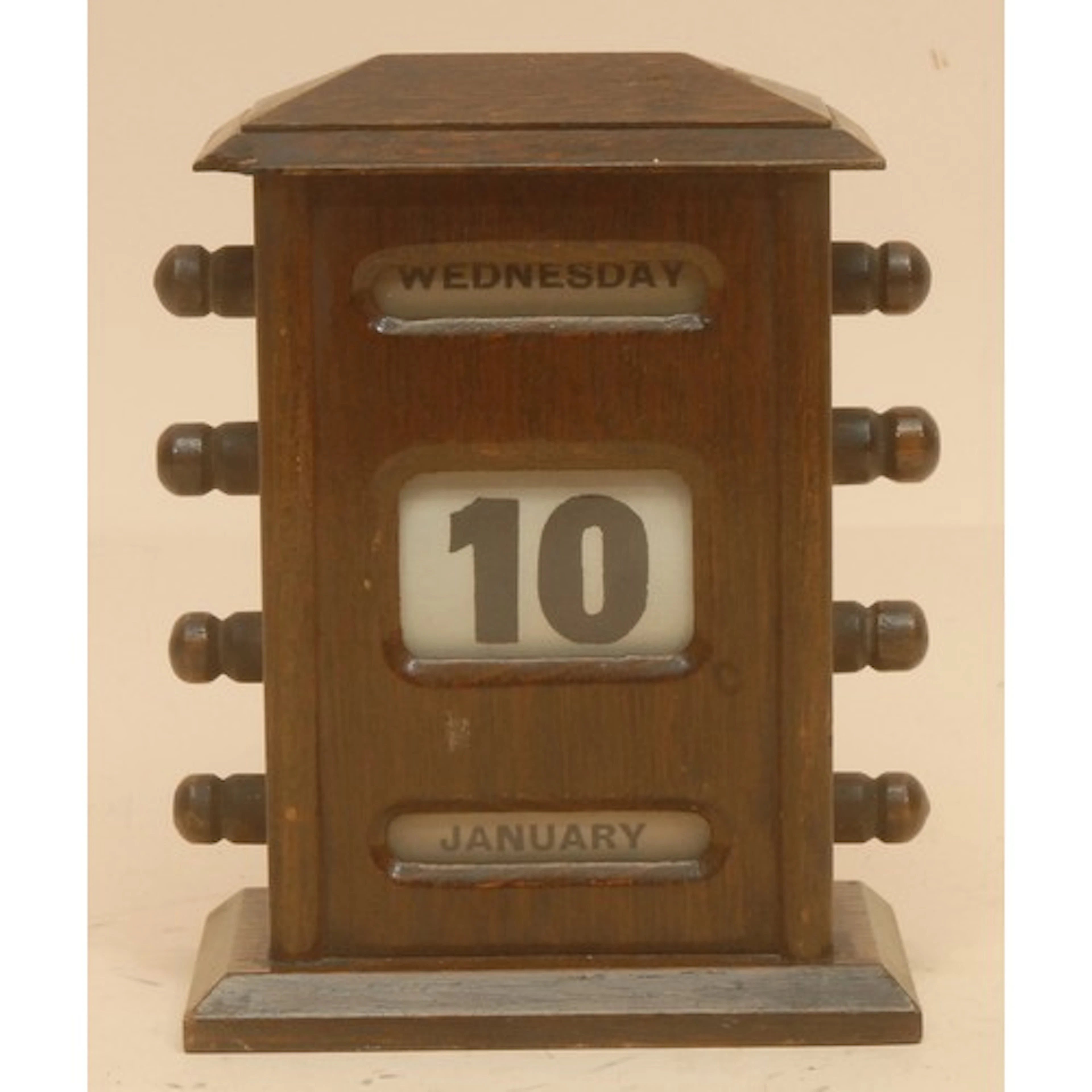 An early 20th century oak perpetual desk calendar, sarcophag...