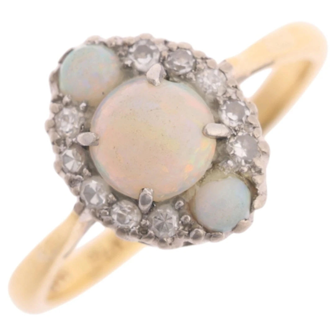 An 18ct gold opal and diamond cluster ring, platinum-topped,...