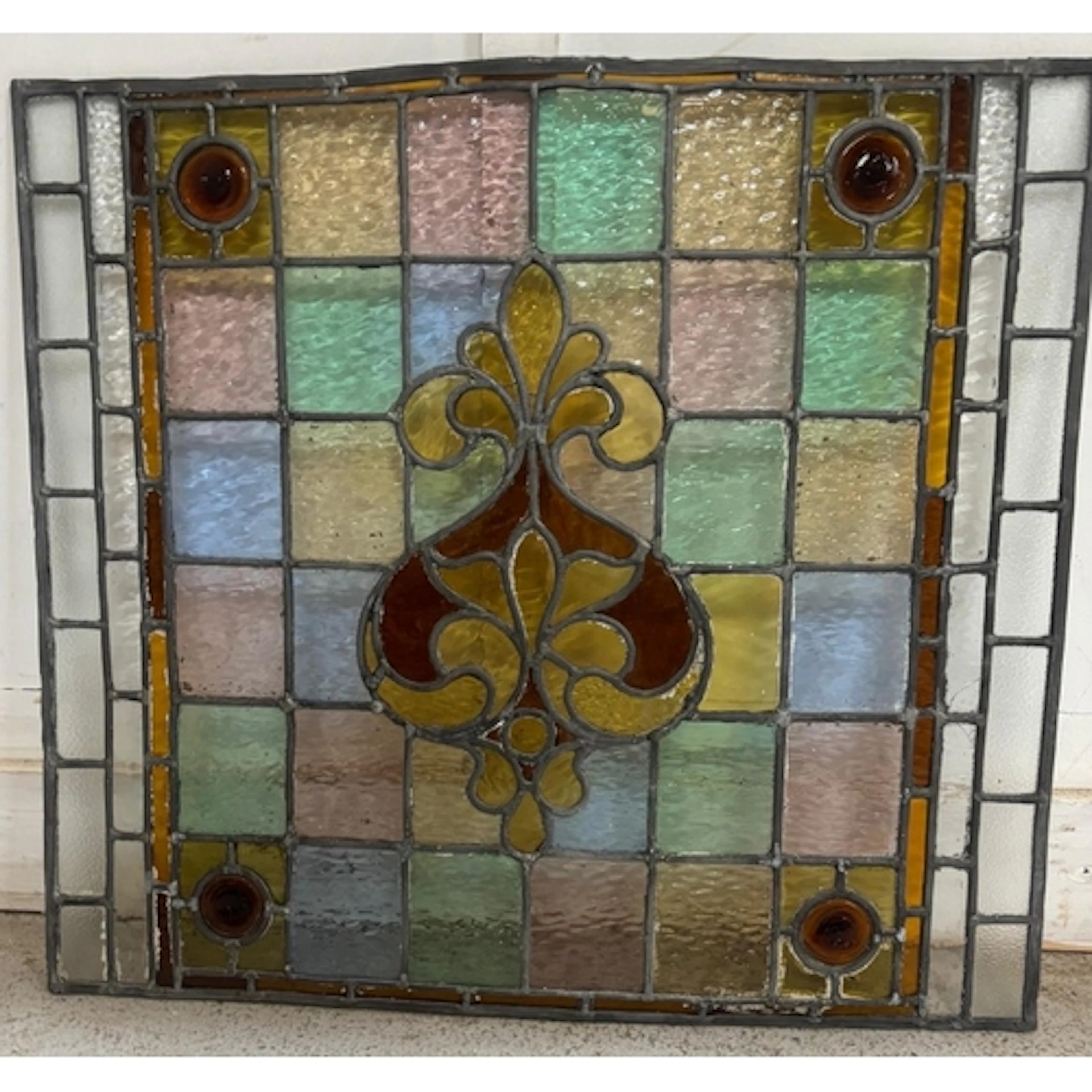 A vinted stained glass panel featuring a striking red and ye...