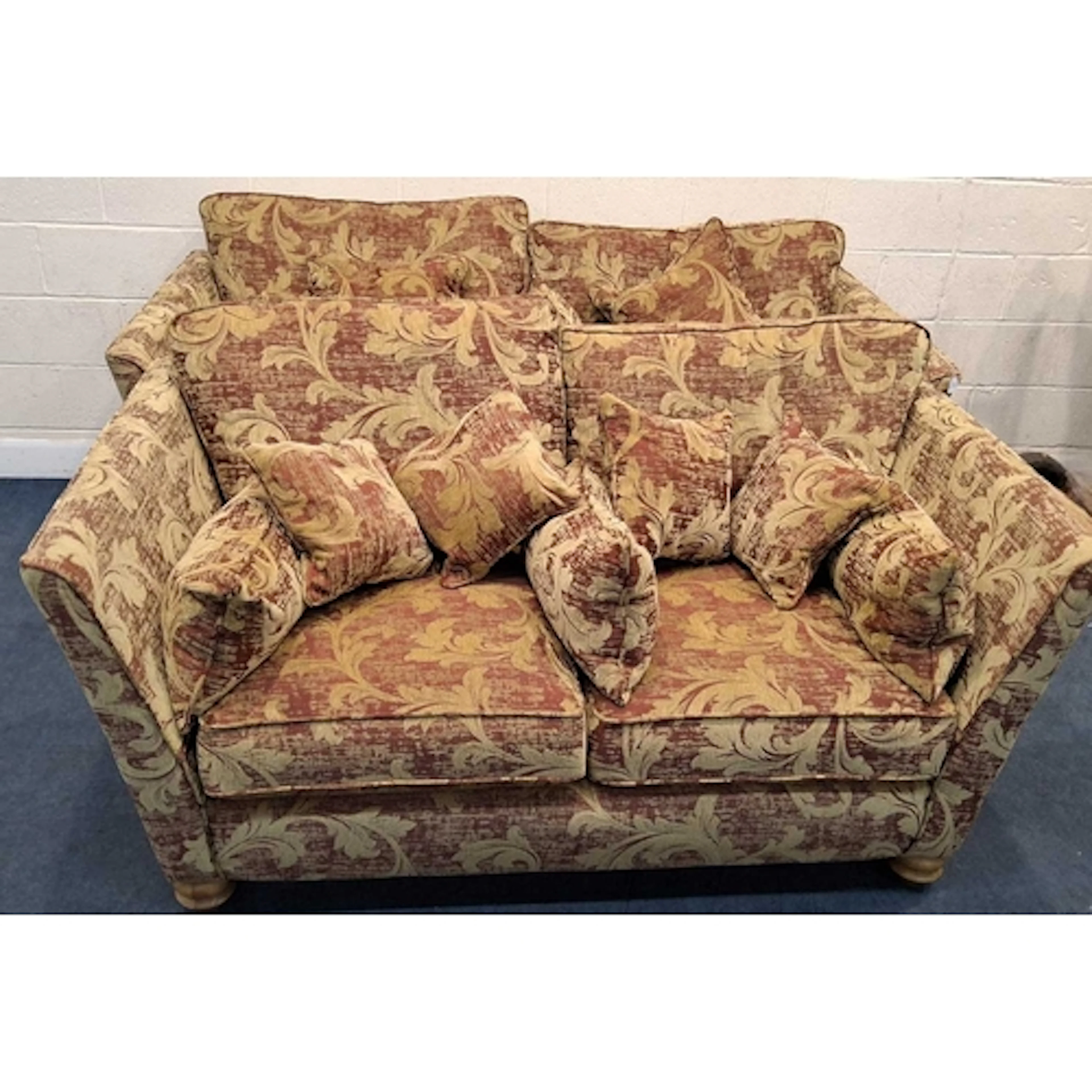 A RED AND GOLD FOLIATE UPHOLSTERED TWO-PIECE LOUNGE SUITE, c...
