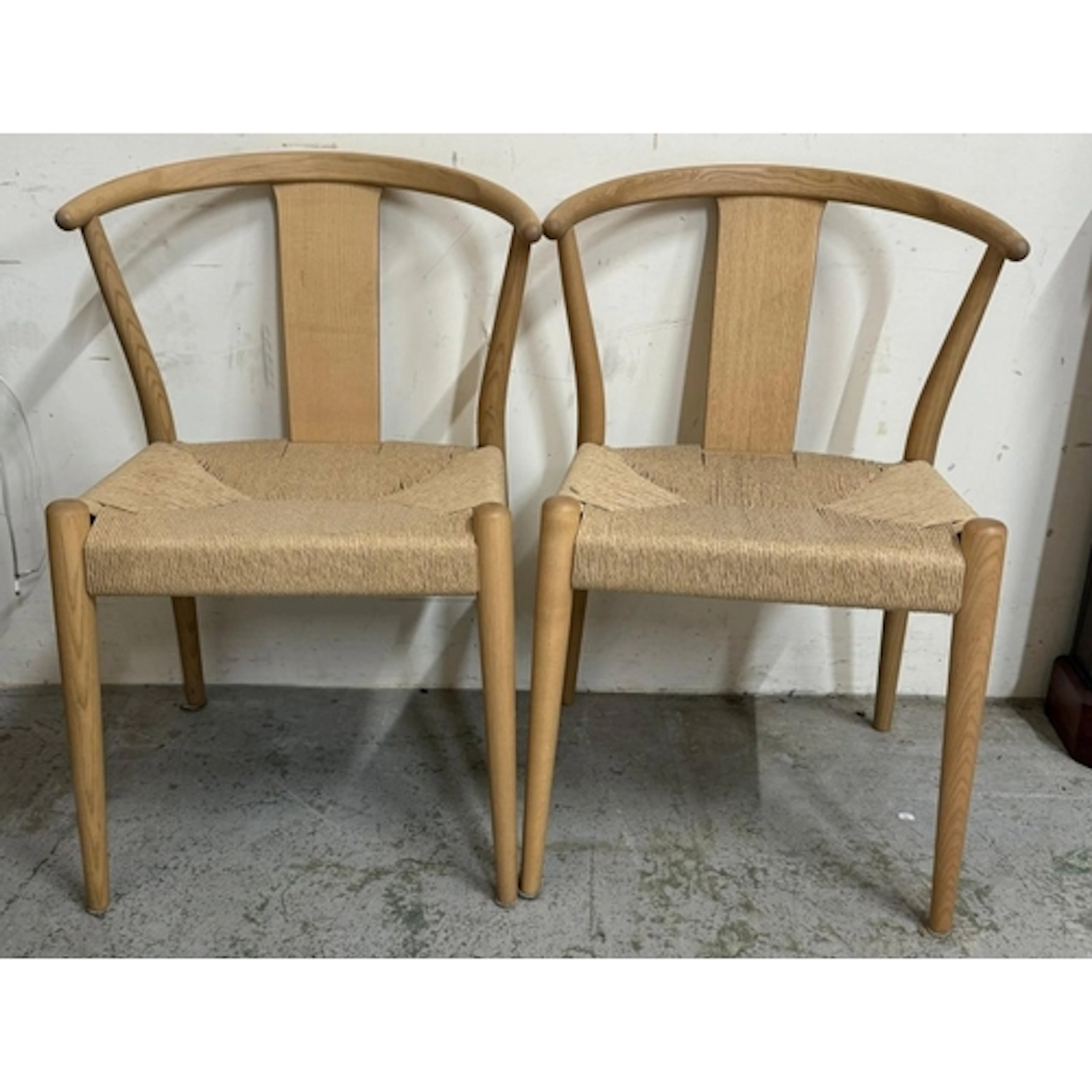 A pair of Elm rush seated wishbone chairs