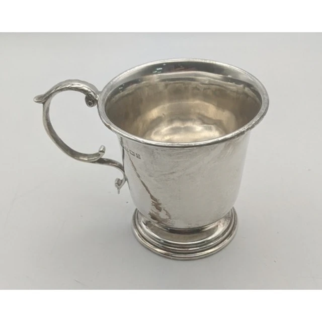 A silver Christening mug hallmarked Birmingham 1952, having ...