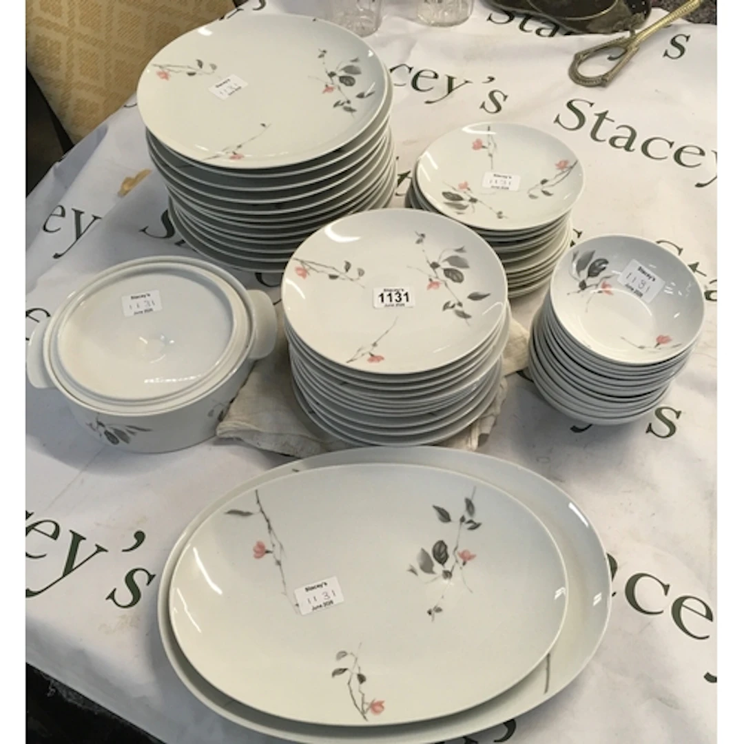 A set of ceramic table equipment. The patterns feature delic...
