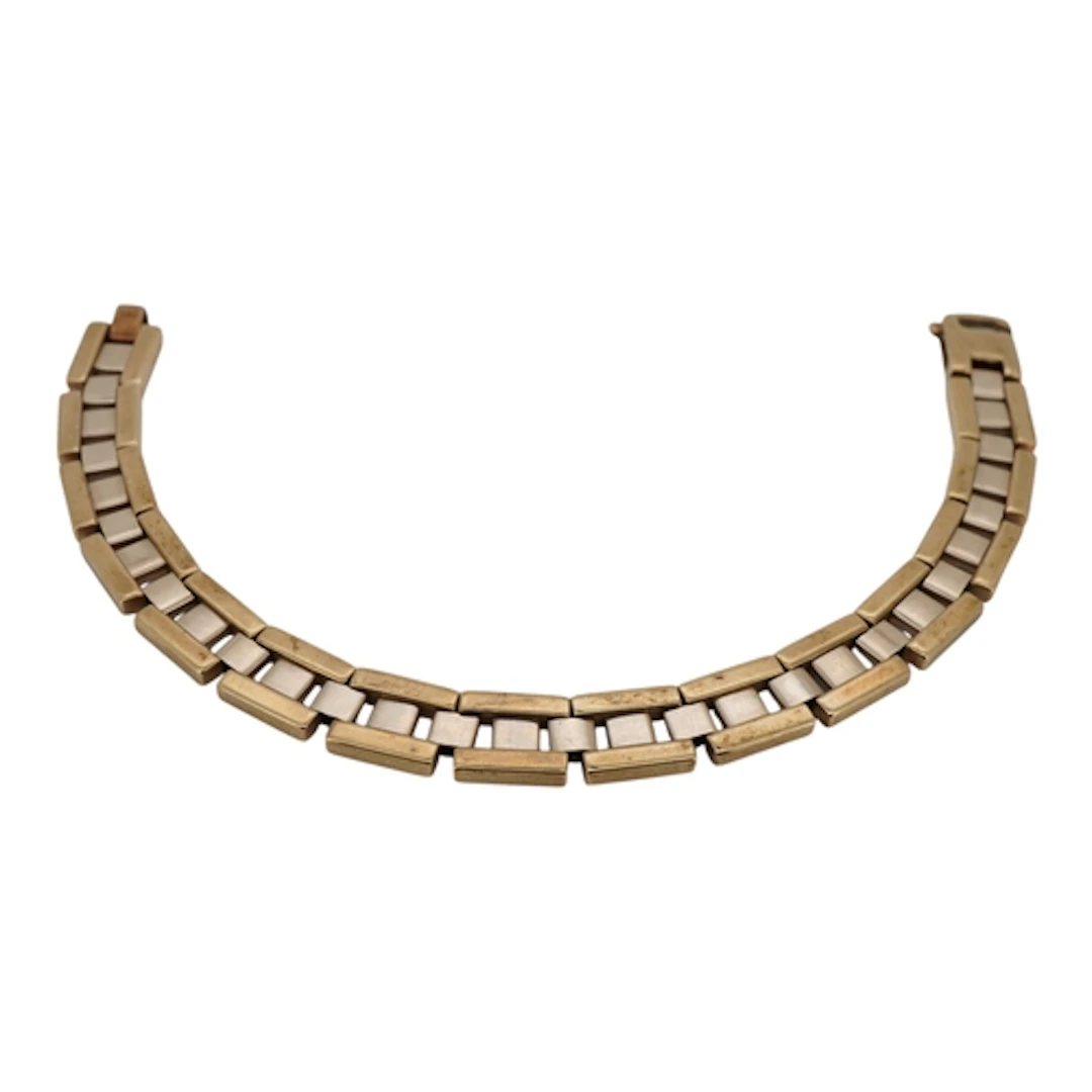 A two colour yellow metal brick link bracelet, stamped 375, ...