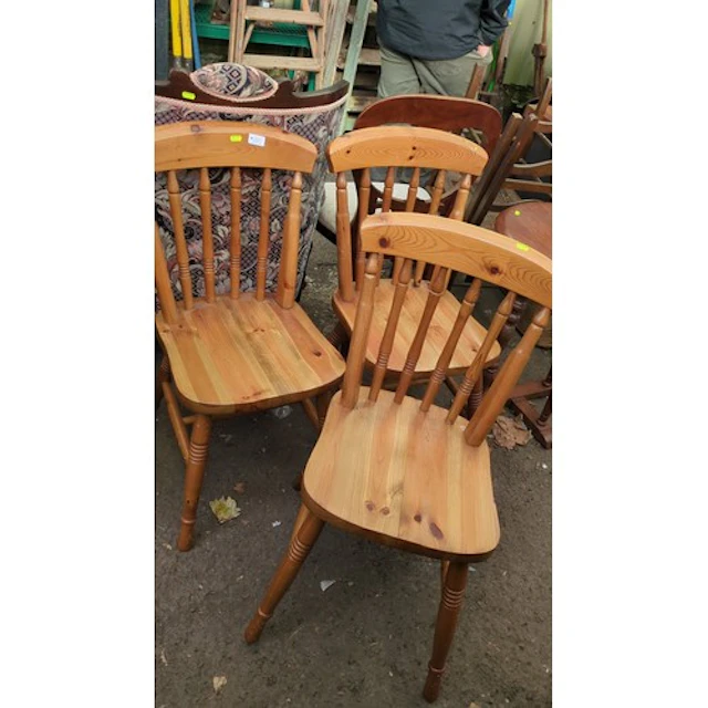 Three pine kitchen chairs with curved crest rails, turned sp...