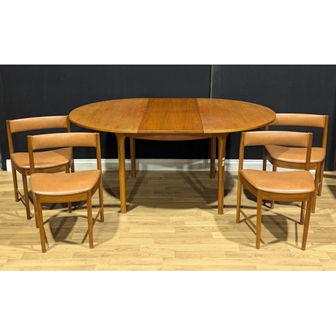 Mid-century Design - a McIntosh teak extending dining table;...