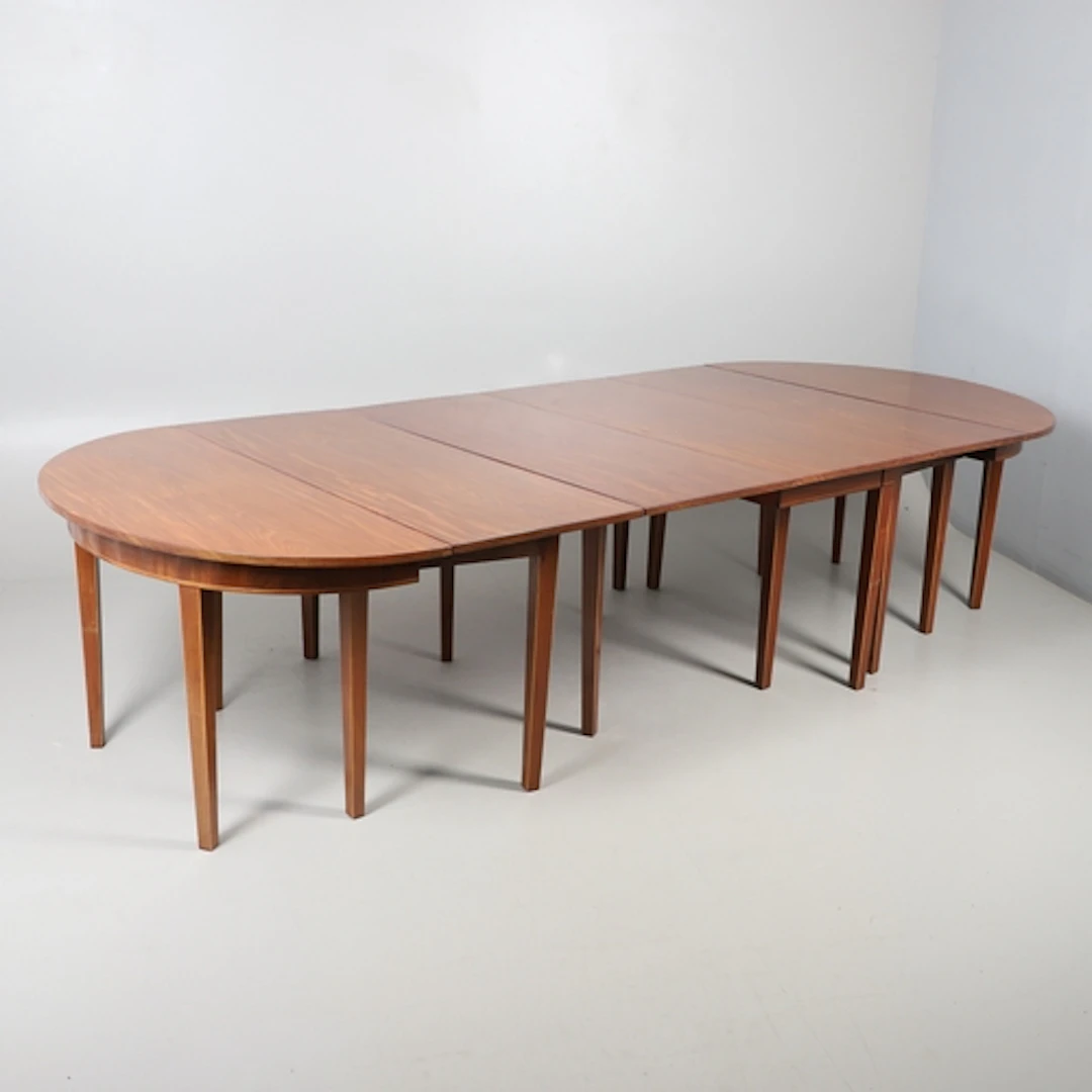 A MAHOGANY EXTENDING DINING TABLE OF GEORGE III DESIGN. cons...