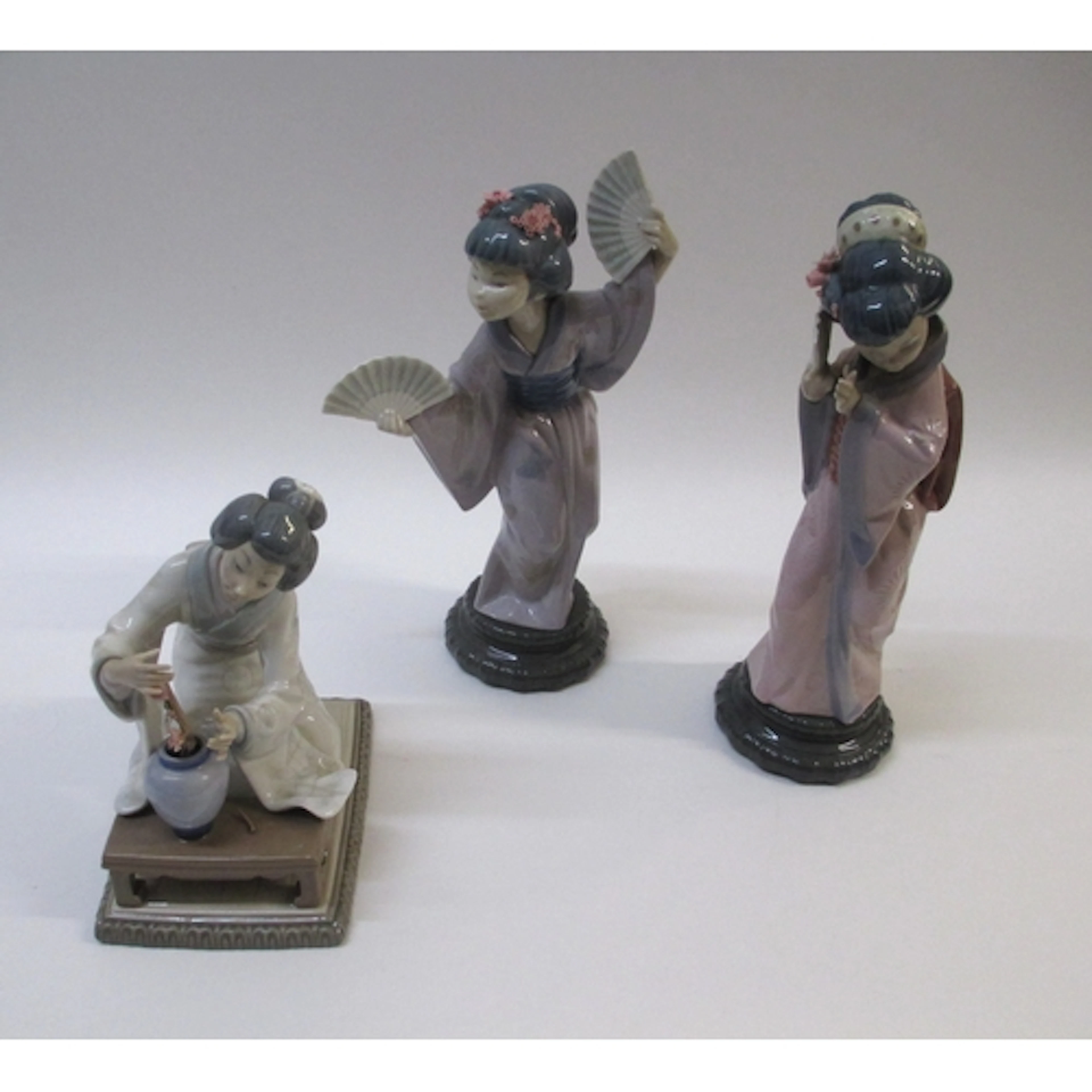 Three Lladro porcelain figures of Japanese girls, numbers 49...