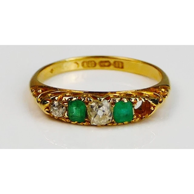 An antique emerald and diamond ring in an 18ct gold setting,...