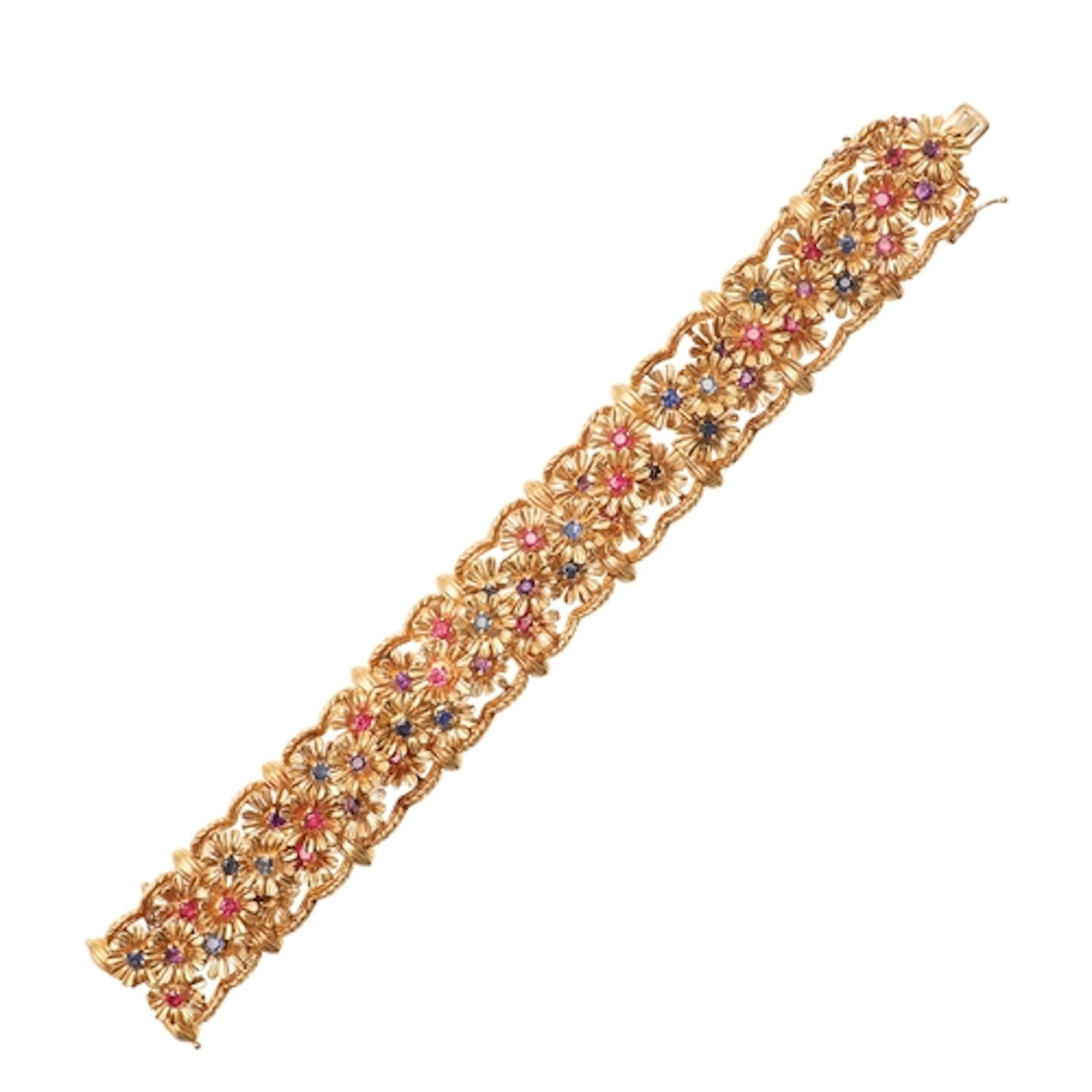 A RUBY, SAPPHIRE, AMETHYST AND 18CT GOLD BRACELET BY KUTCHIN...