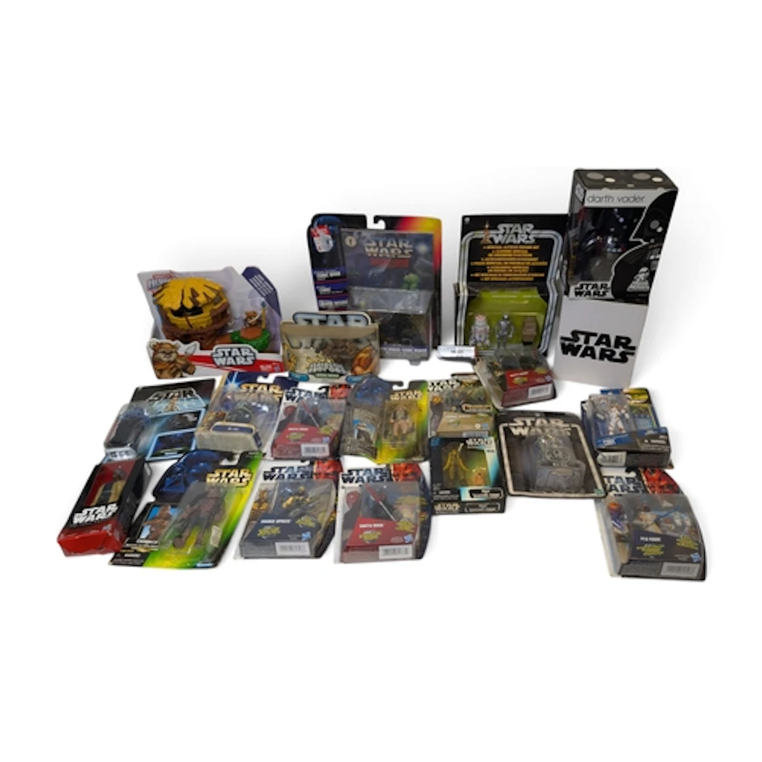 A shelf of various Star Wars models and collectible figures ...