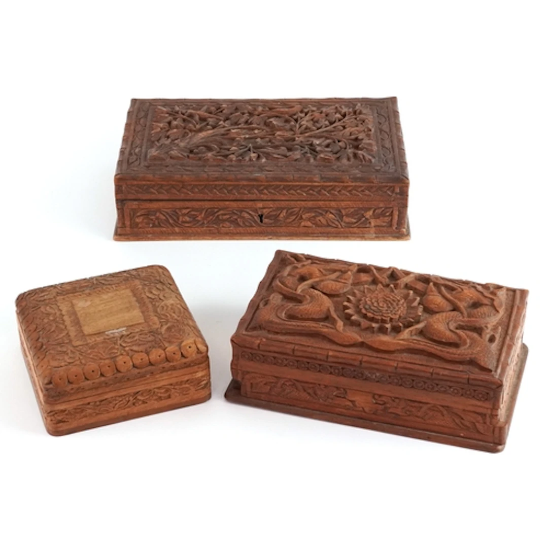 Three Chinese and Eastern carved wood jewellery boxes profus...