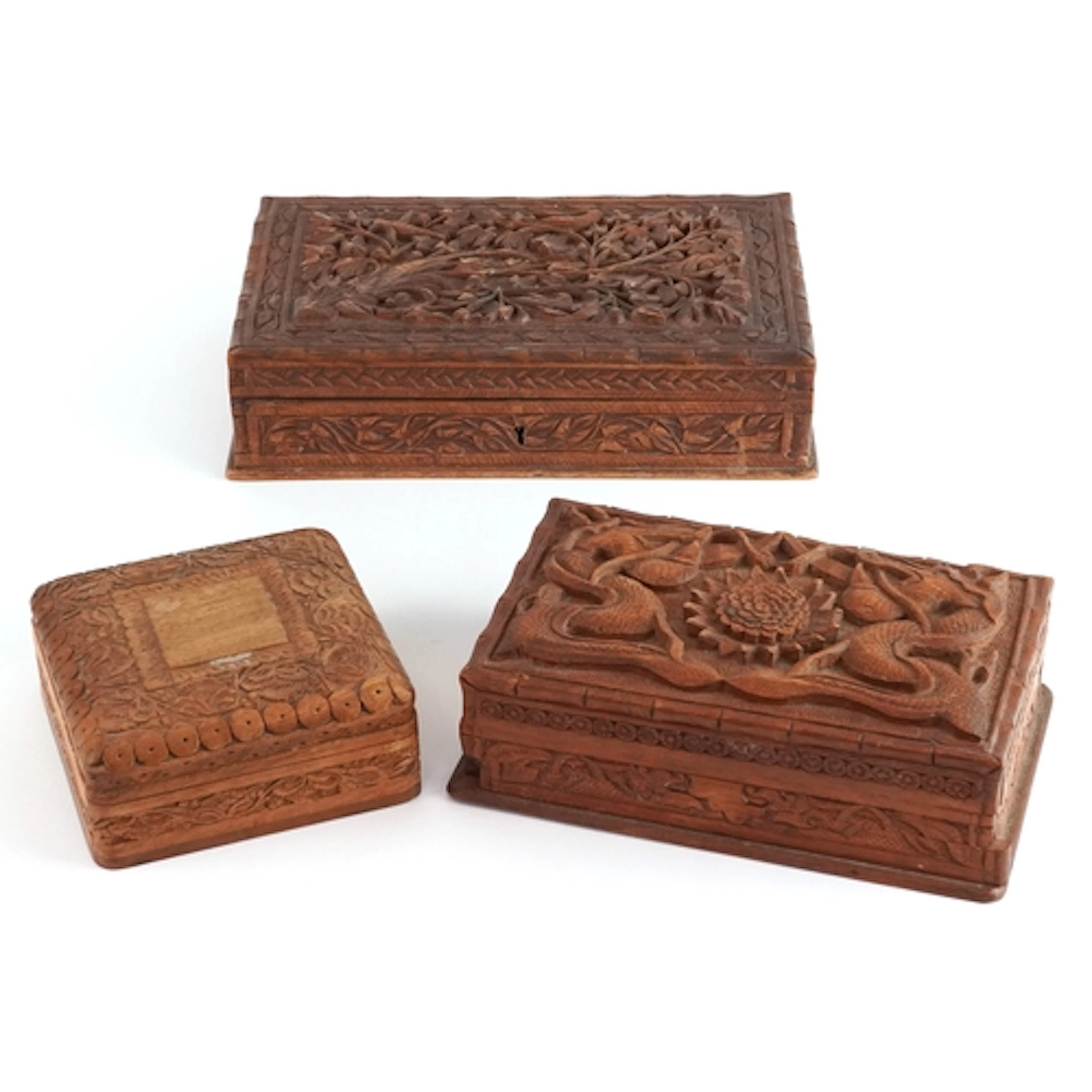 Three Chinese and Eastern carved wood jewellery boxes profus...
