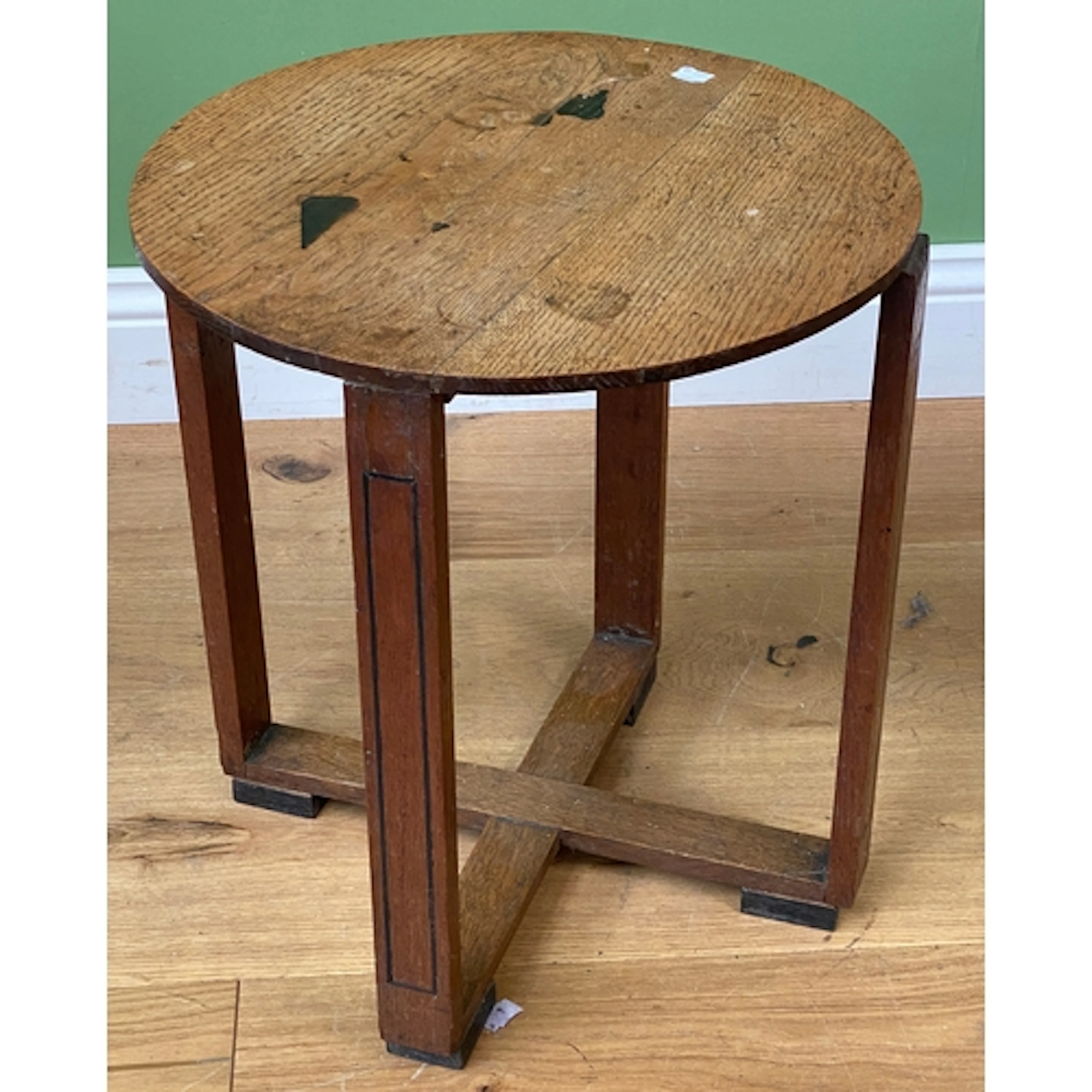 An Art Deco oak occasional table, circular top on four ebony...
