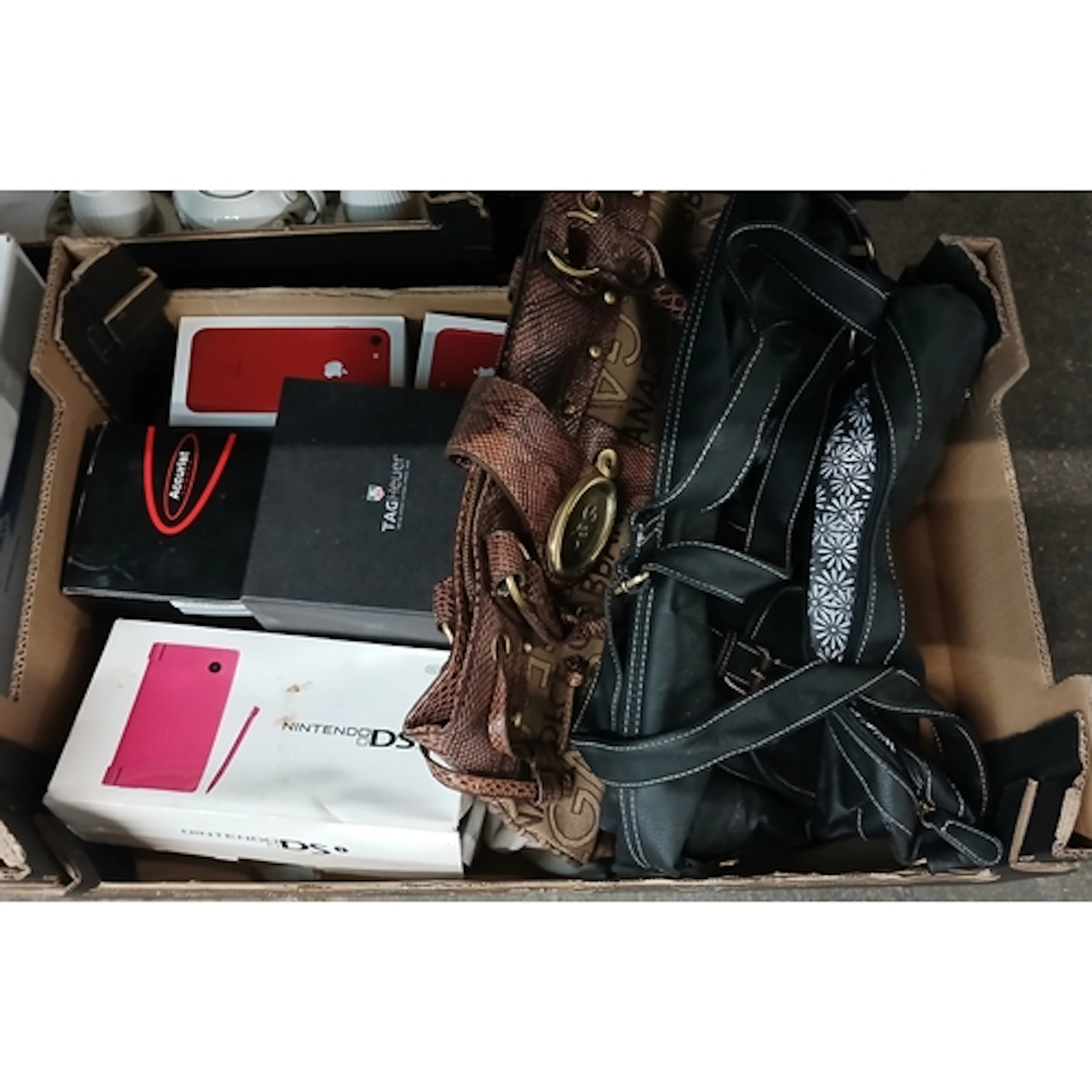A box including two iPhone boxes, one containing one iPhone ...
