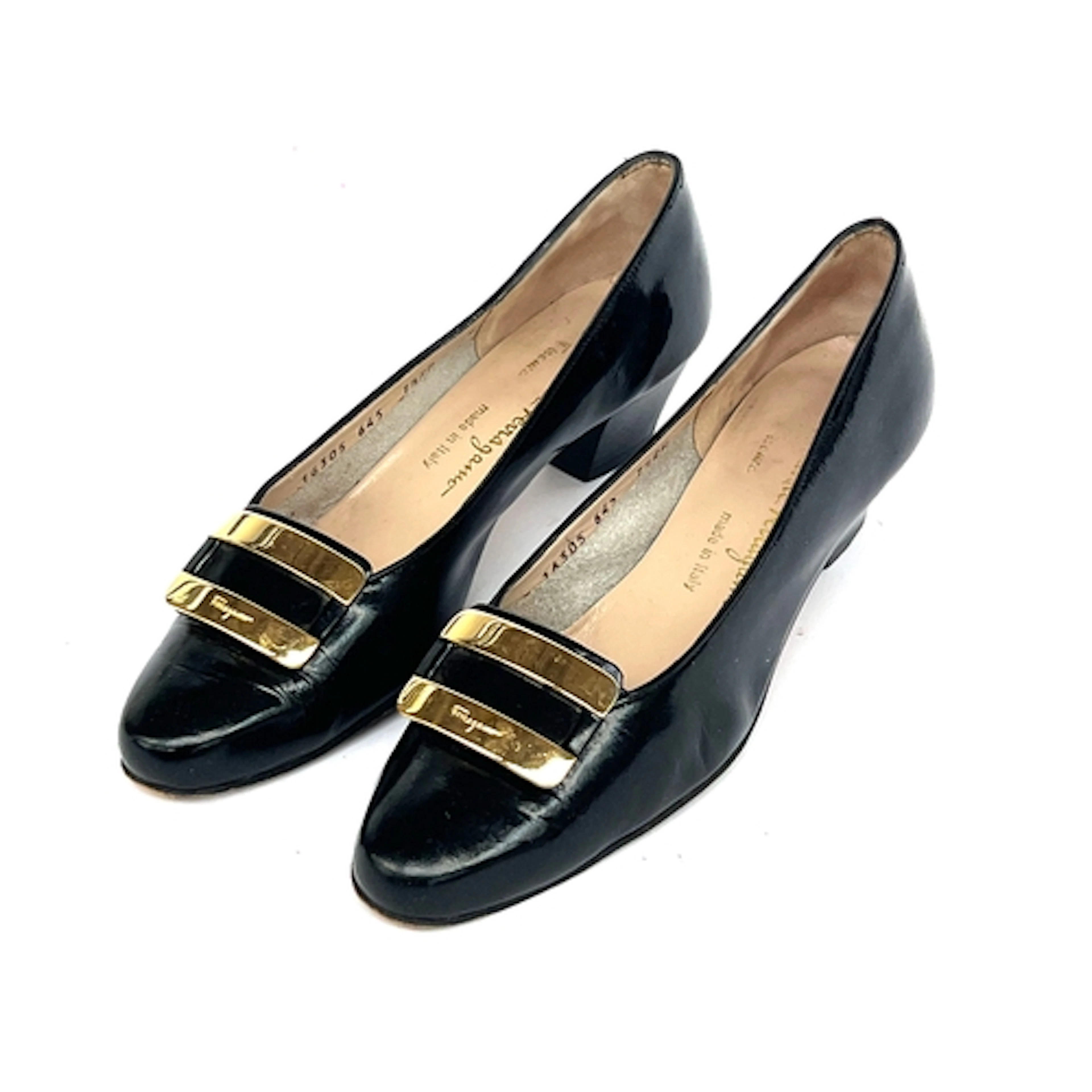 A pair of Ferragamo Boutique black patent leather heels with...