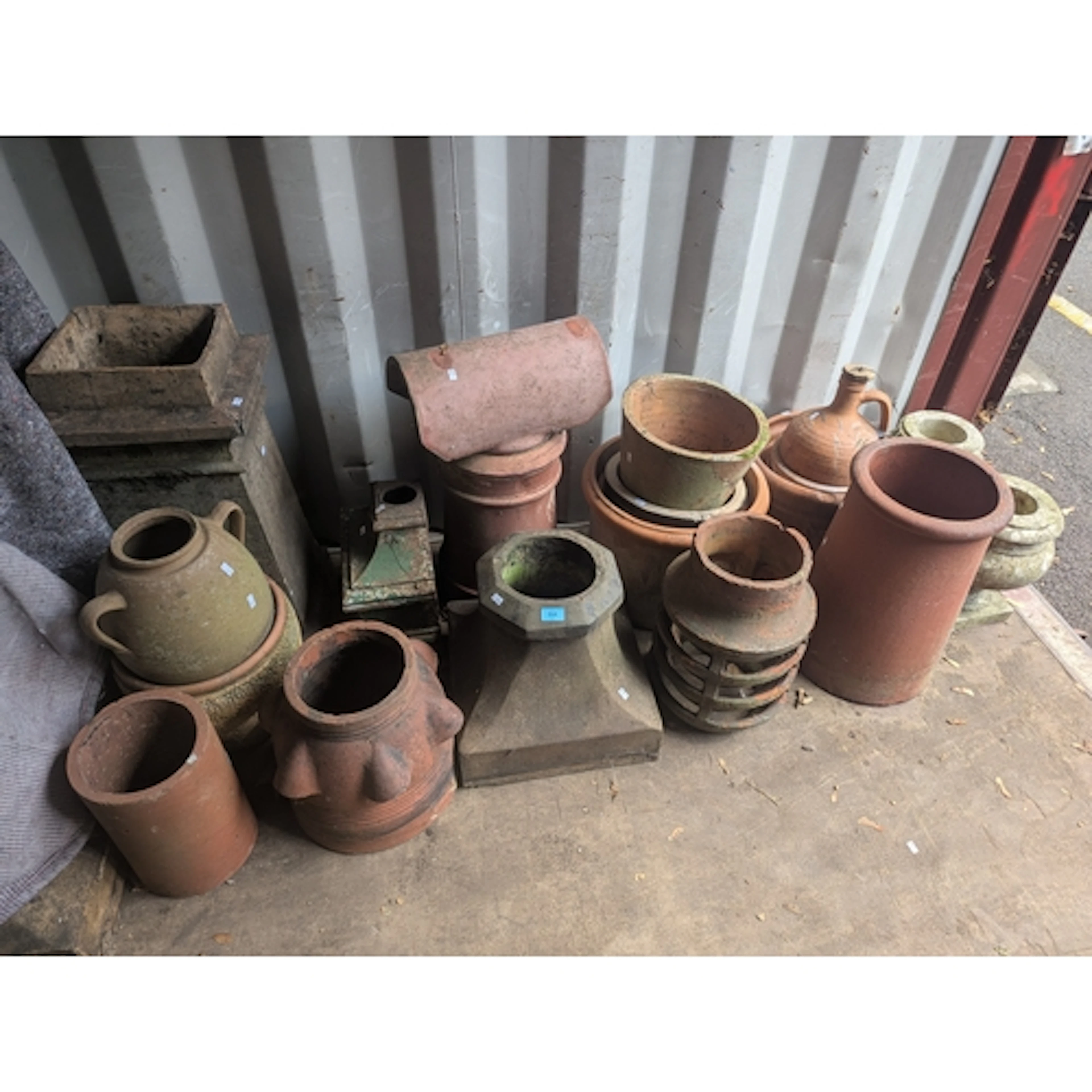 A collection of architectural salvage to include chimney pot...