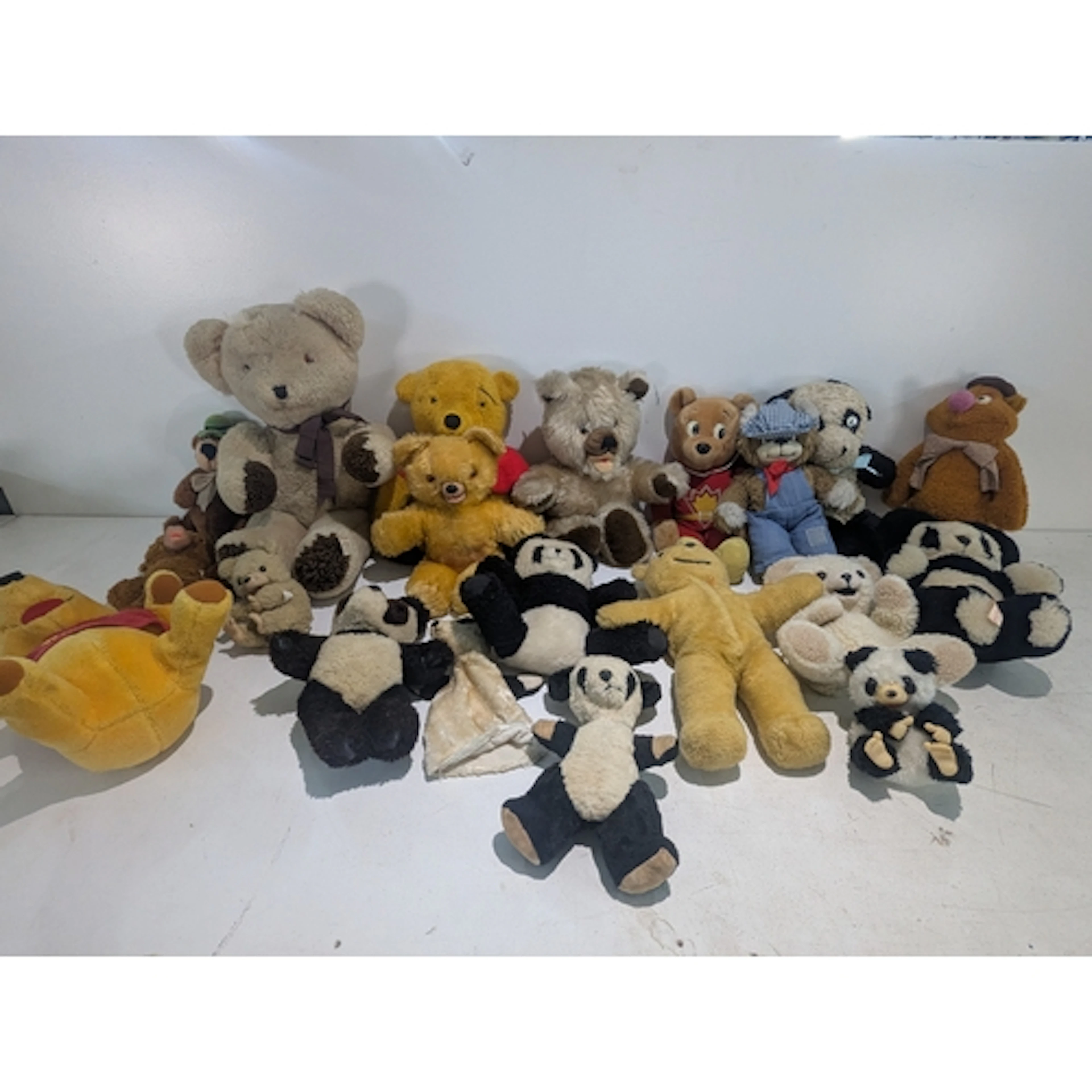 Vintage teddy bears, pandas and TV show characters to includ...