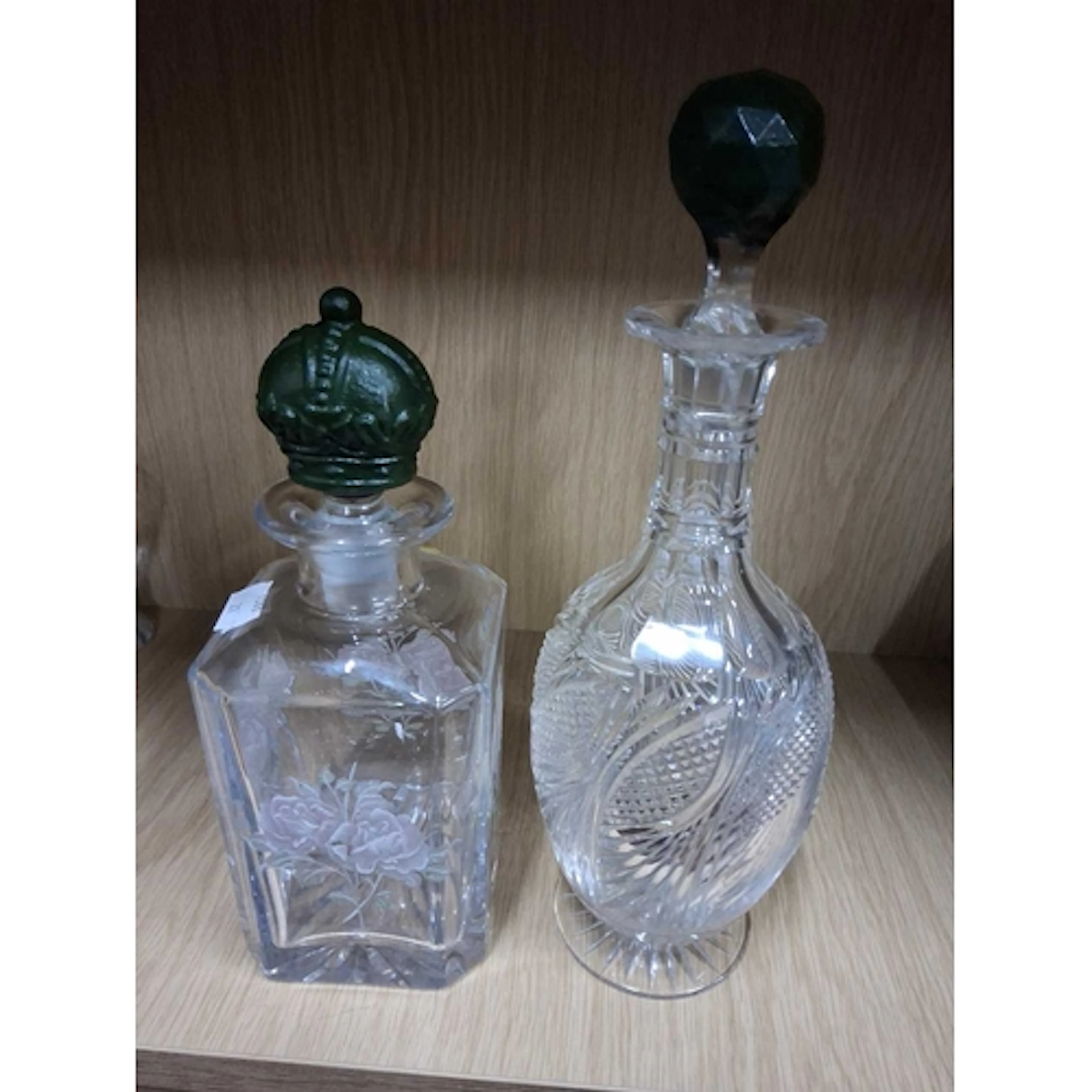 TWO GLASS DECANTERS, comprising a round cut glass decanter o...