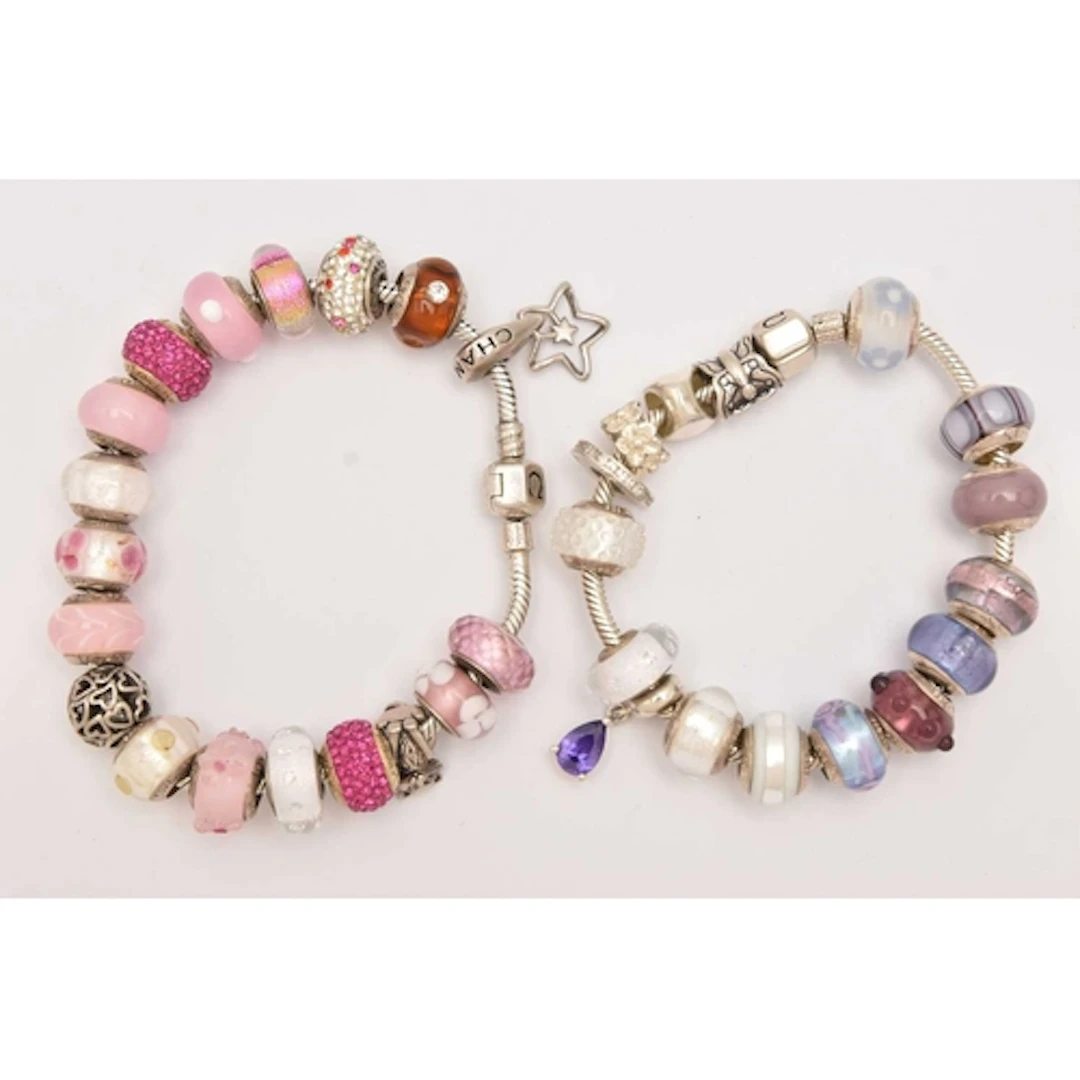 TWO 'CHAMILIA' CHARM BRACELETS, one hallmarked Birmingham, b...