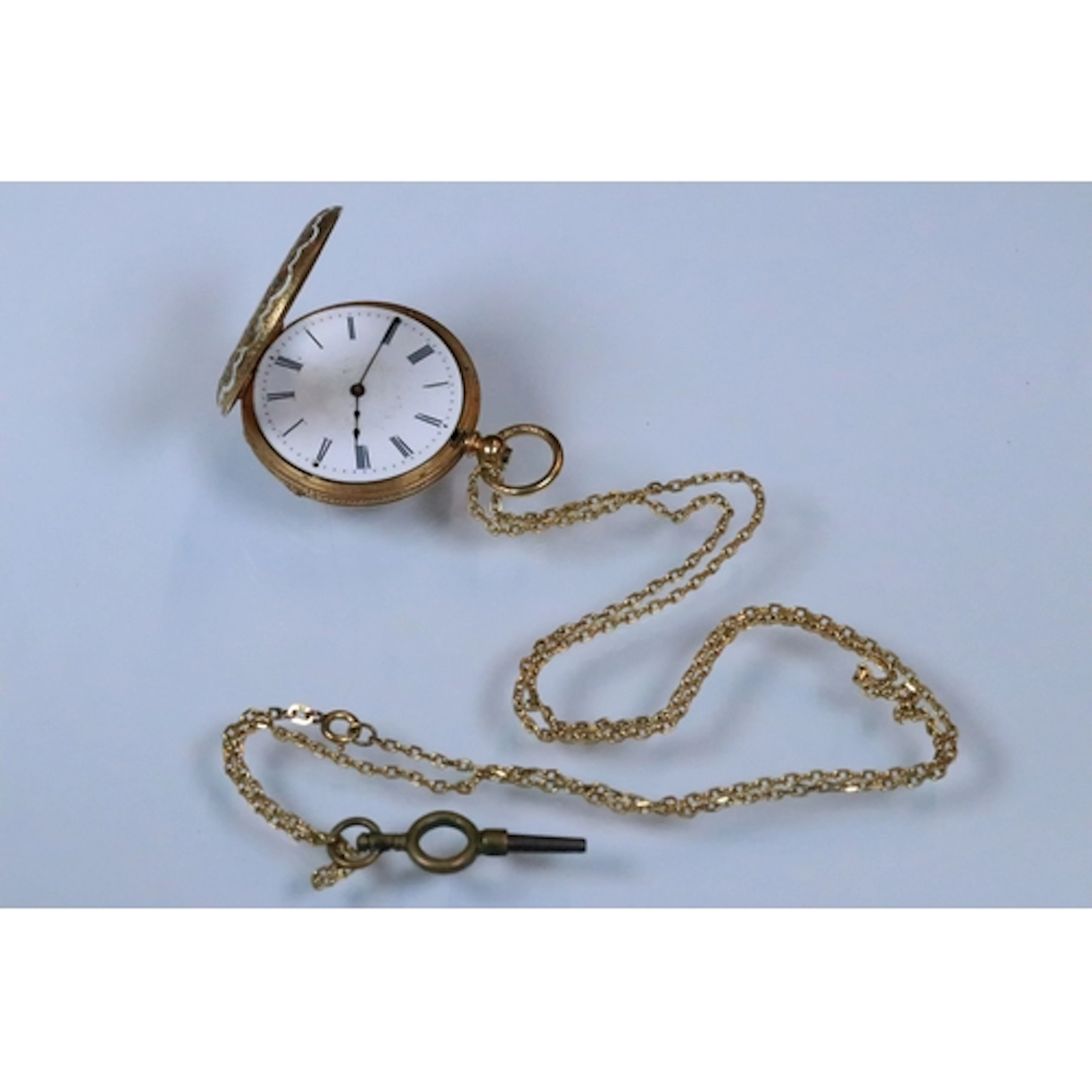18ct gold half hunter enamelled ladies pocket watch. The wat...