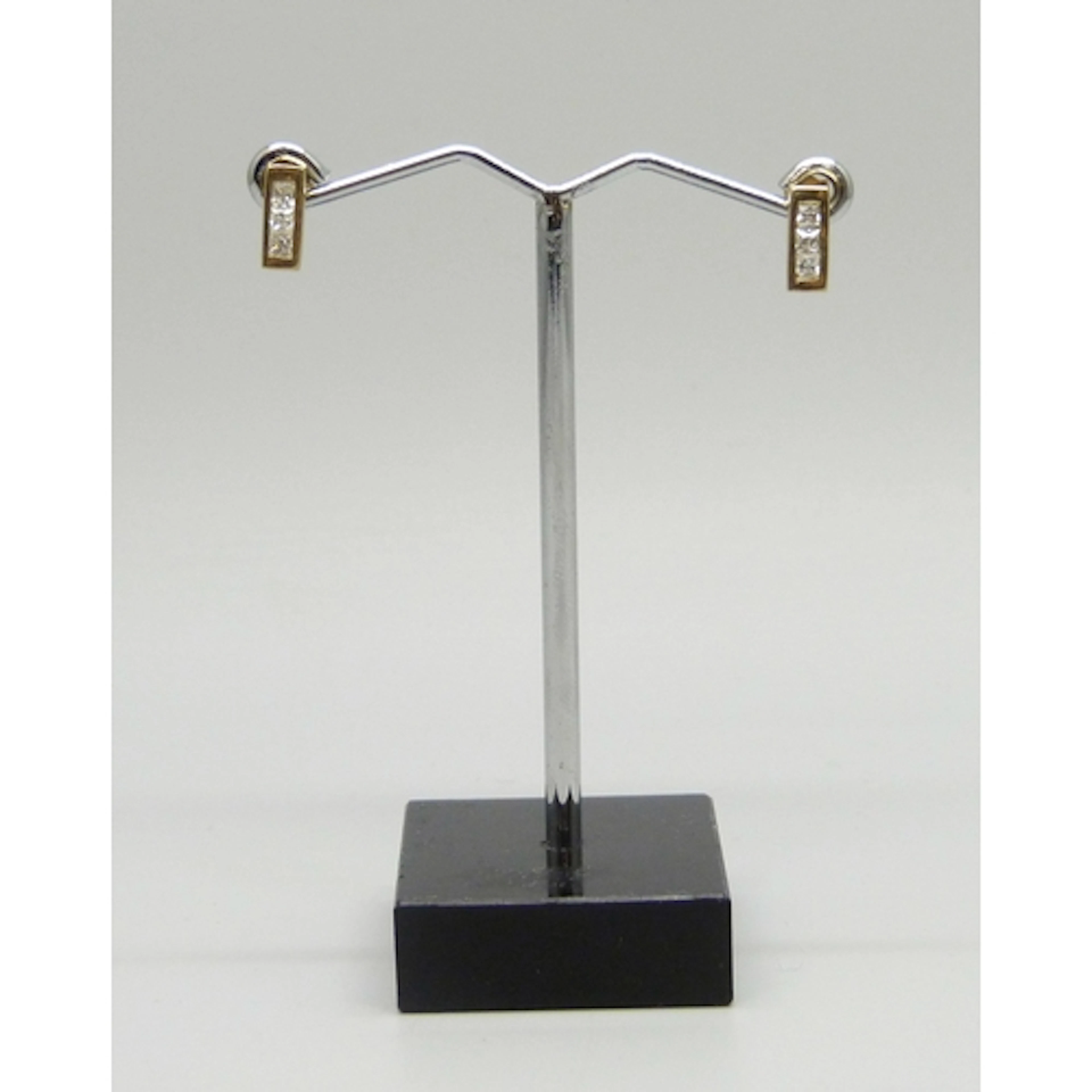 A pair of 9ct gold and white stone earrings, 0.9g, 0.85cm