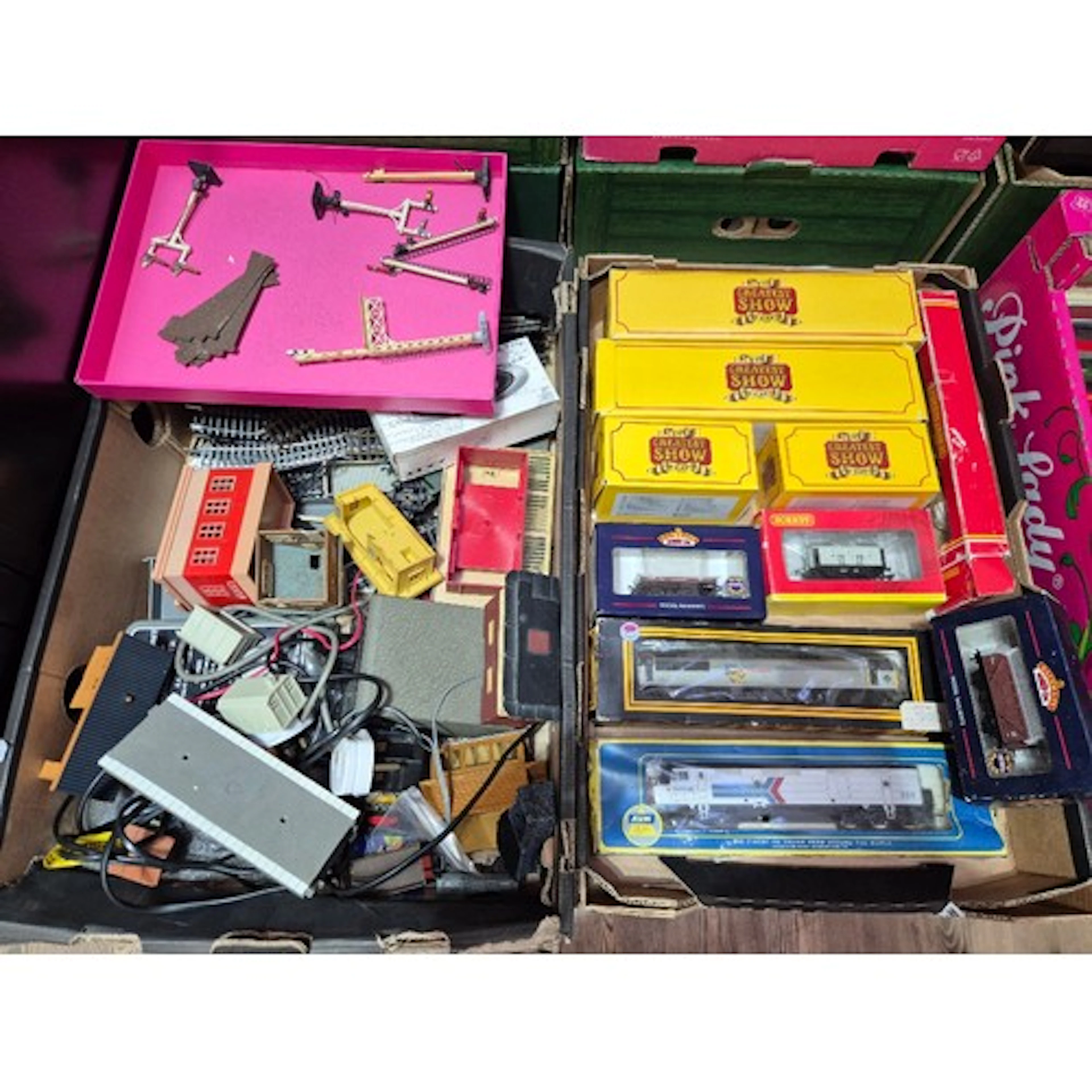 Two boxes of assorted model train items to include engines, ...