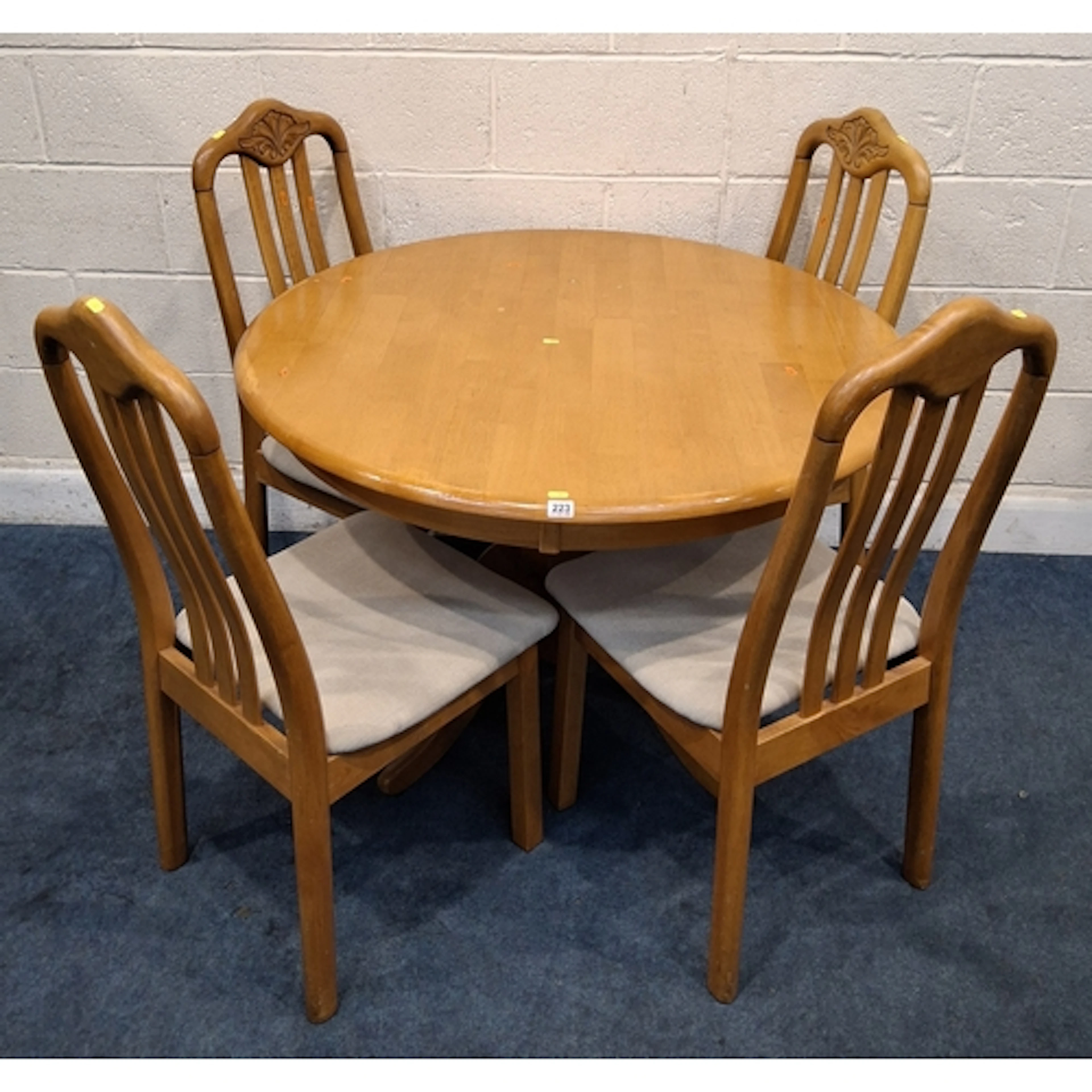 A BEECH CIRCULAR KITCHEN TABLE, raised on a single pedestal ...