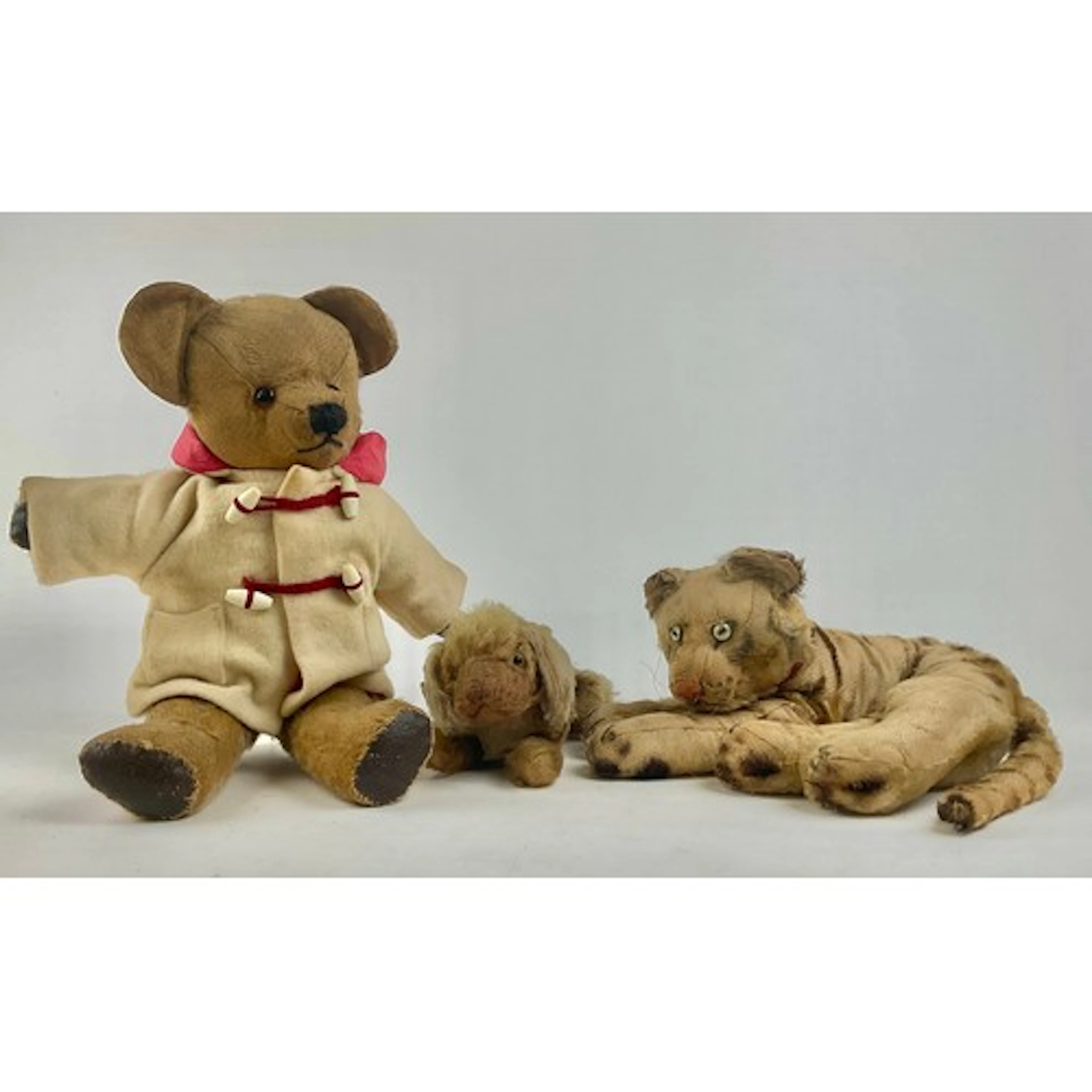 An early 20th century Steiff mohair plush lying tiger, with ...