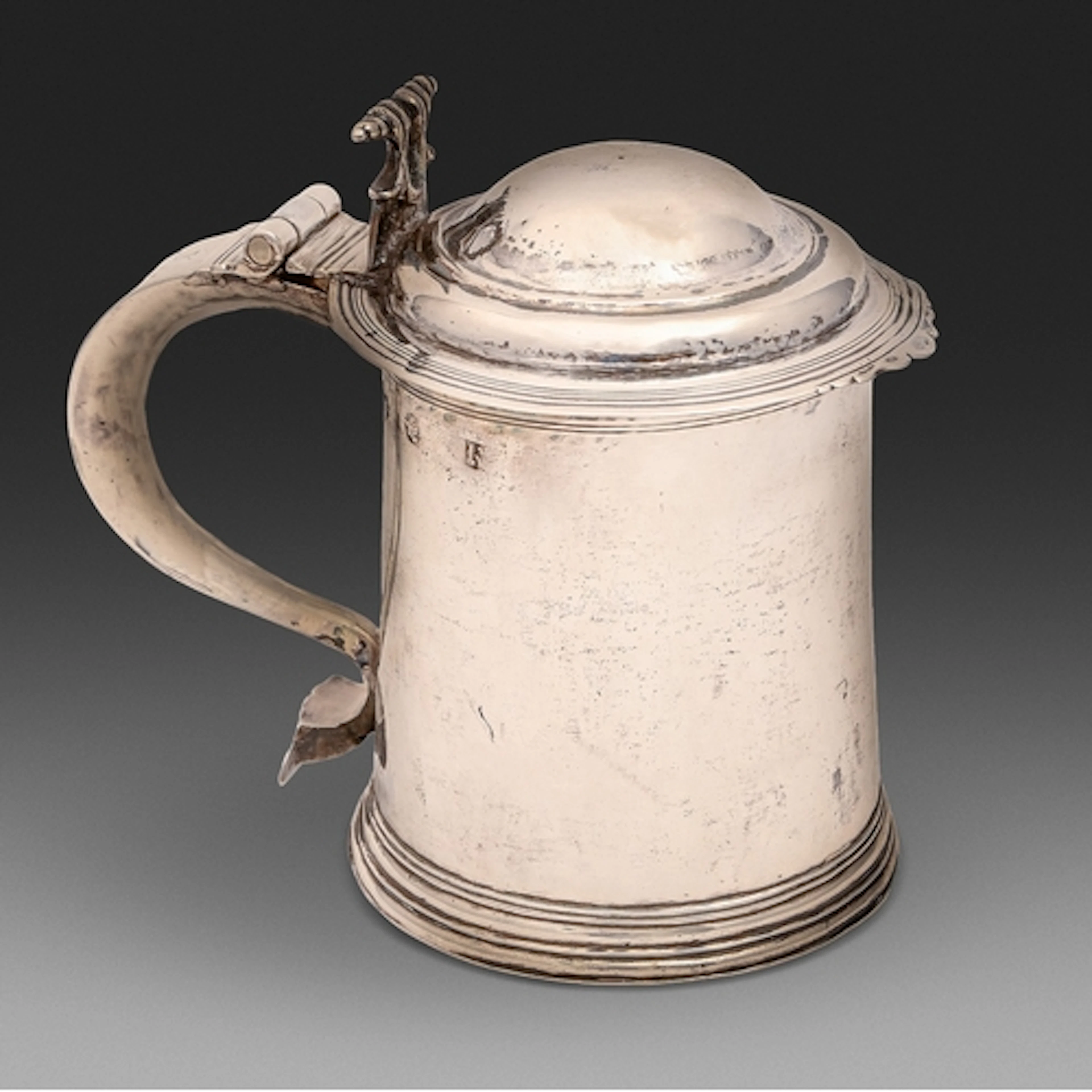 A James II provincial silver tankard, the domed lid with sha...
