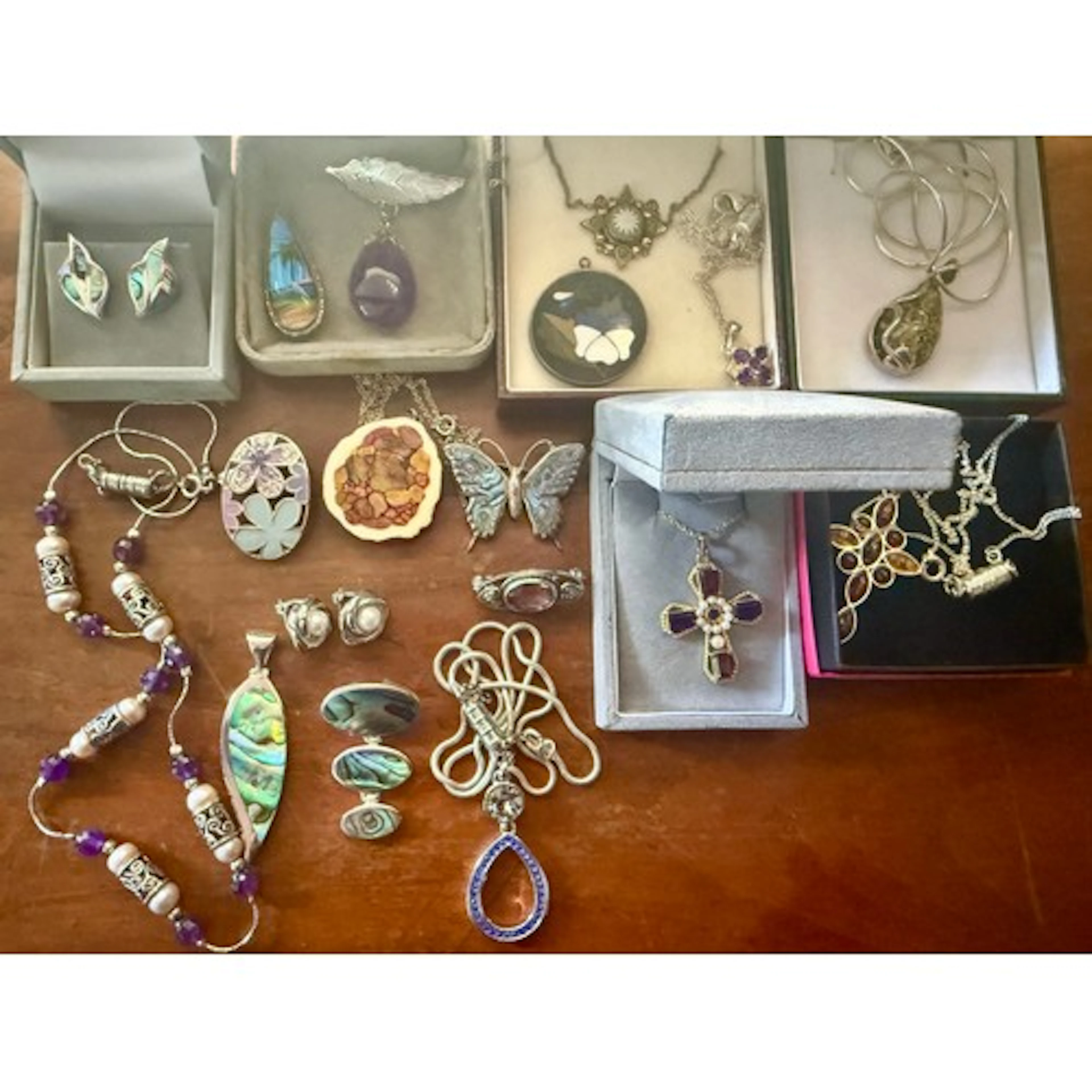 A collection of sterling silver mounted jewellery to include...