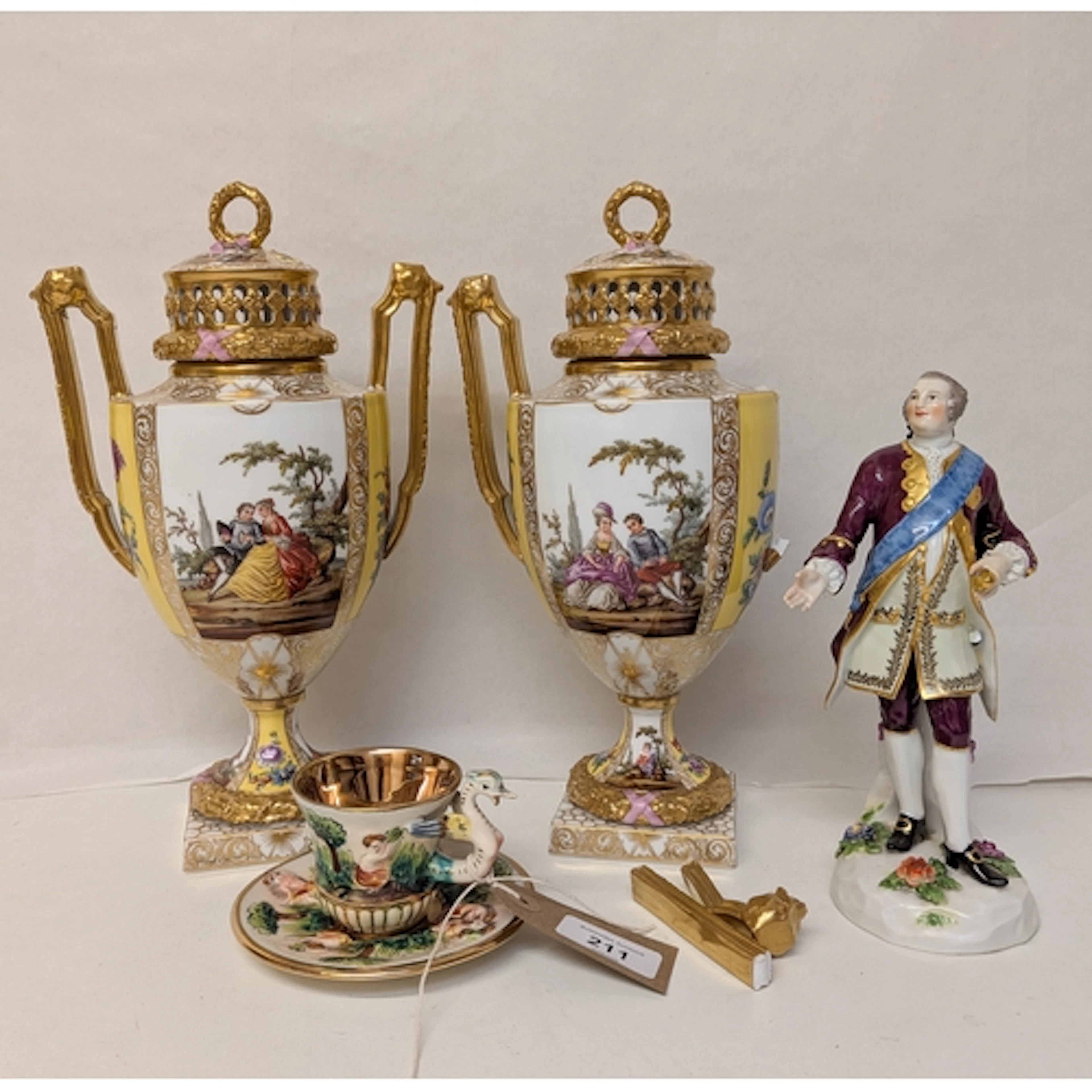 A pair of Dresden twin handled urn shaped pot pourri vases w...