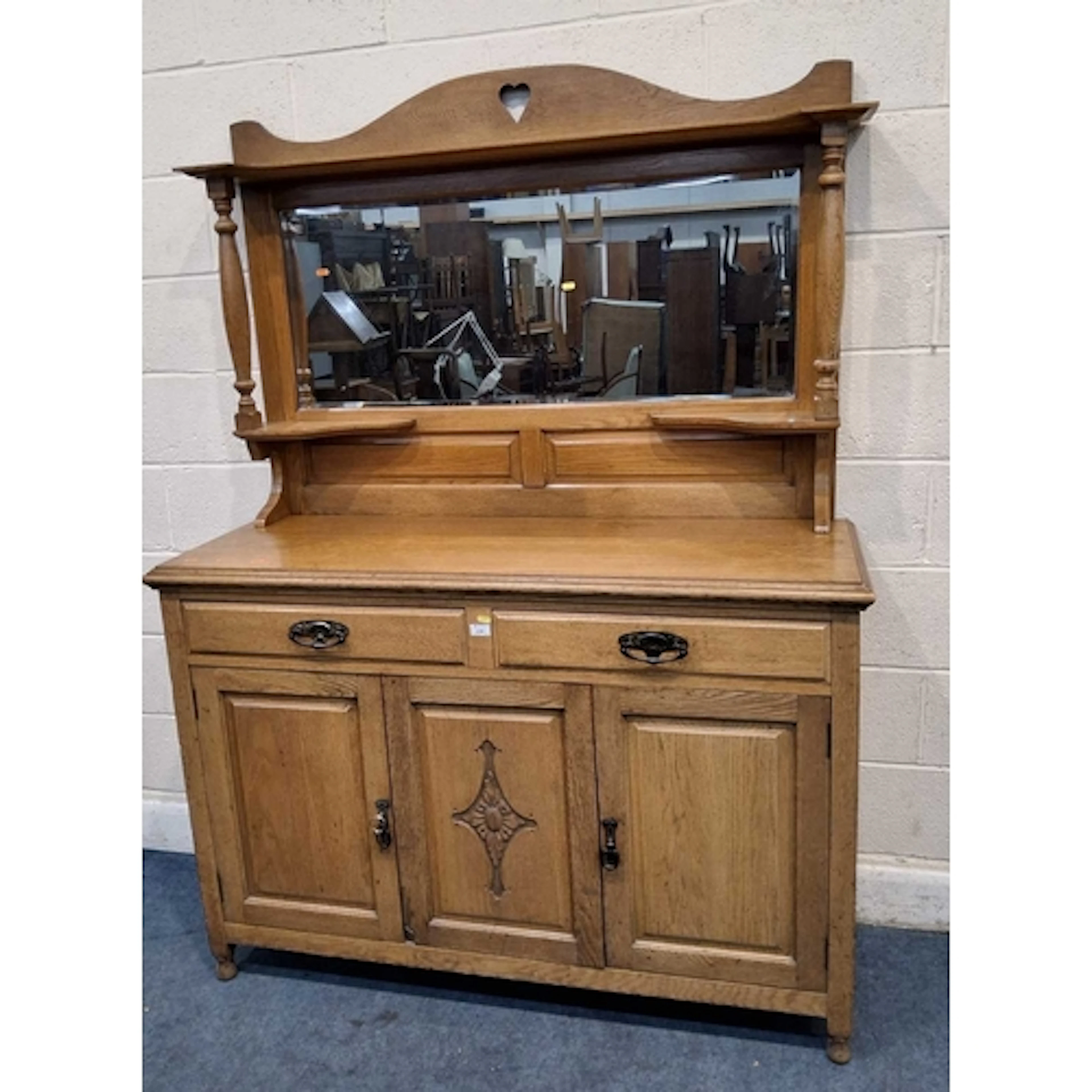 AN EARLY 20TH CENTURY OAK MIRROR BACK SIDEBOARD, the raised ...