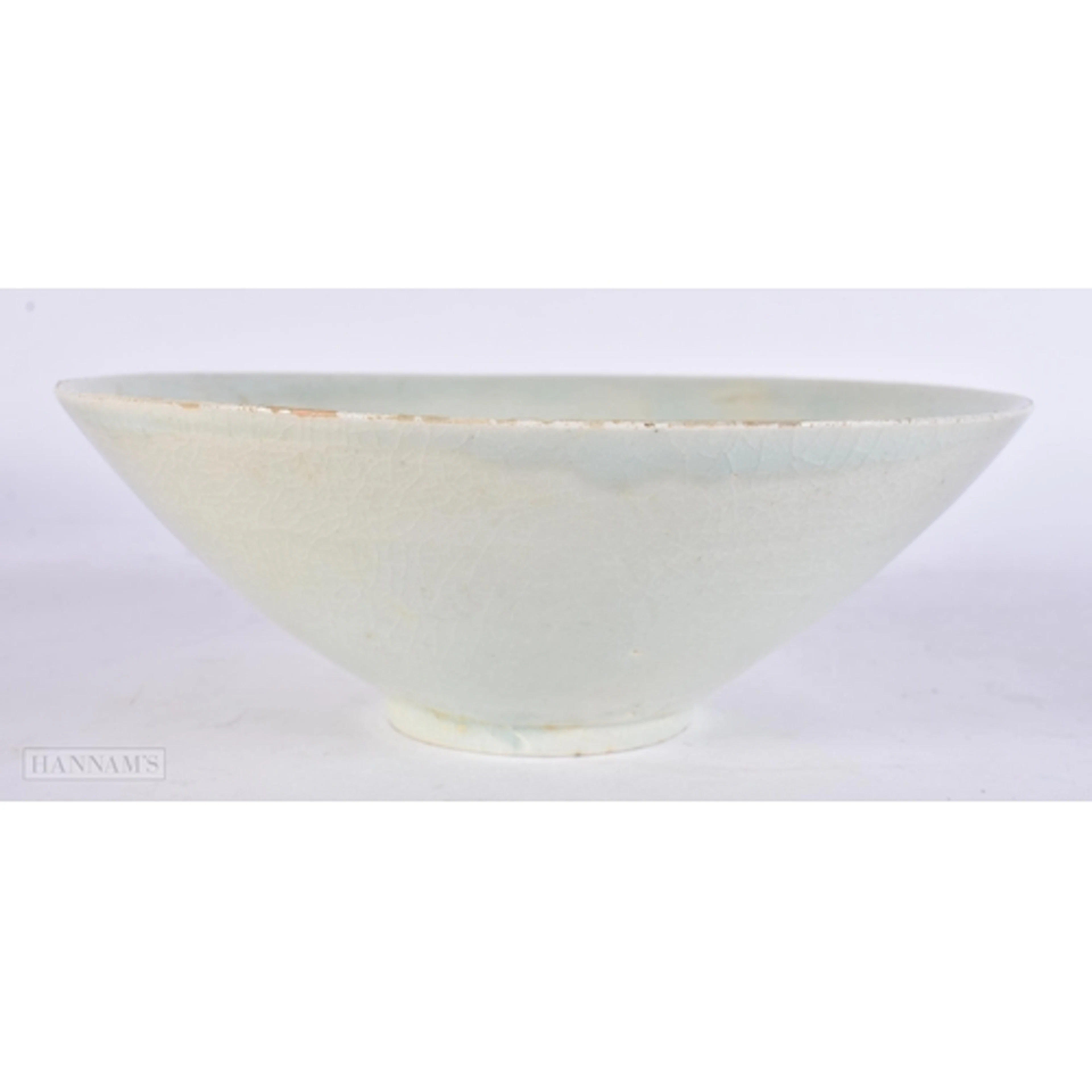 A CHINESE SUNG DYNASTY BOWL 12th/13th Century, incised with ...