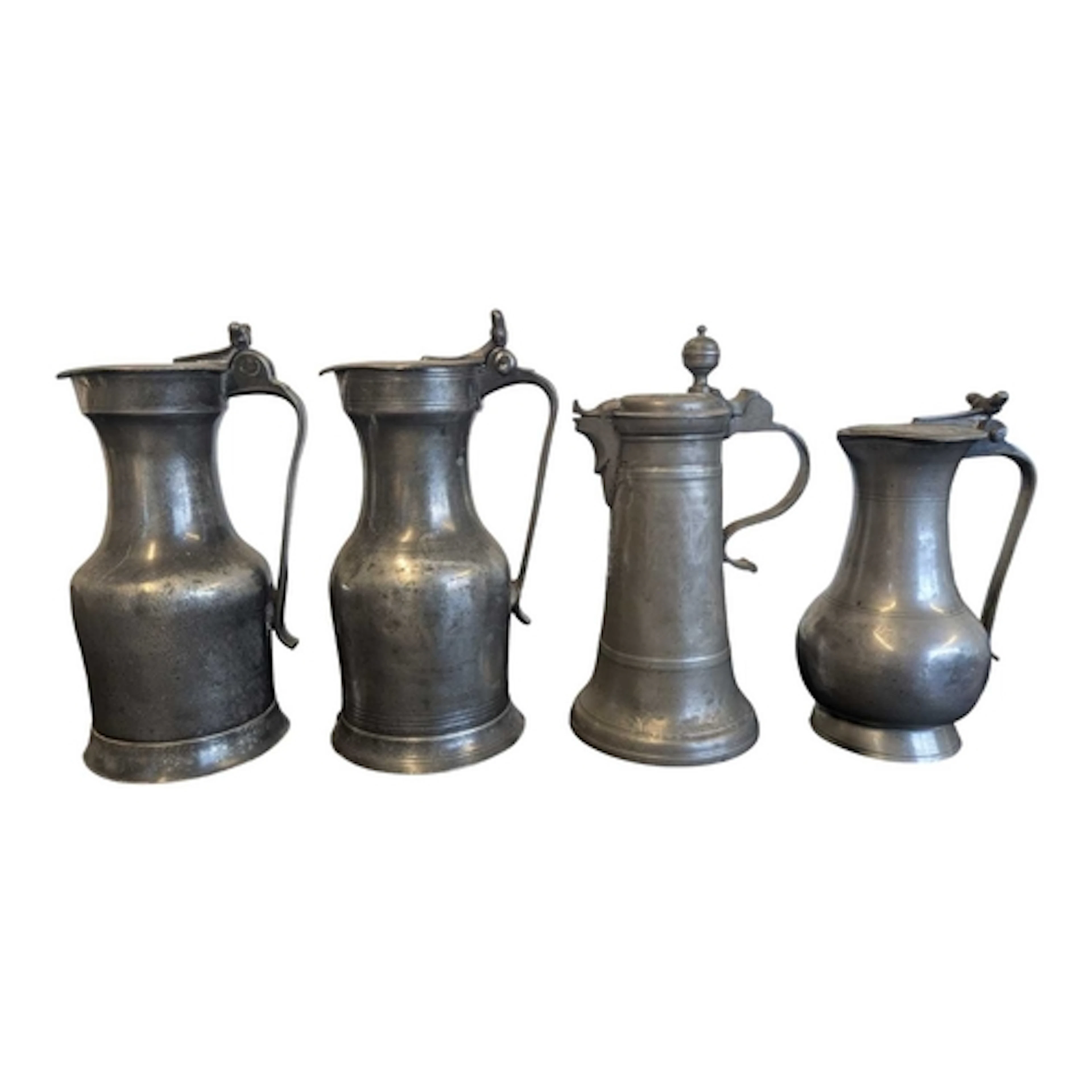Collection of 18th and 19th century pewter lidded flagons. E...