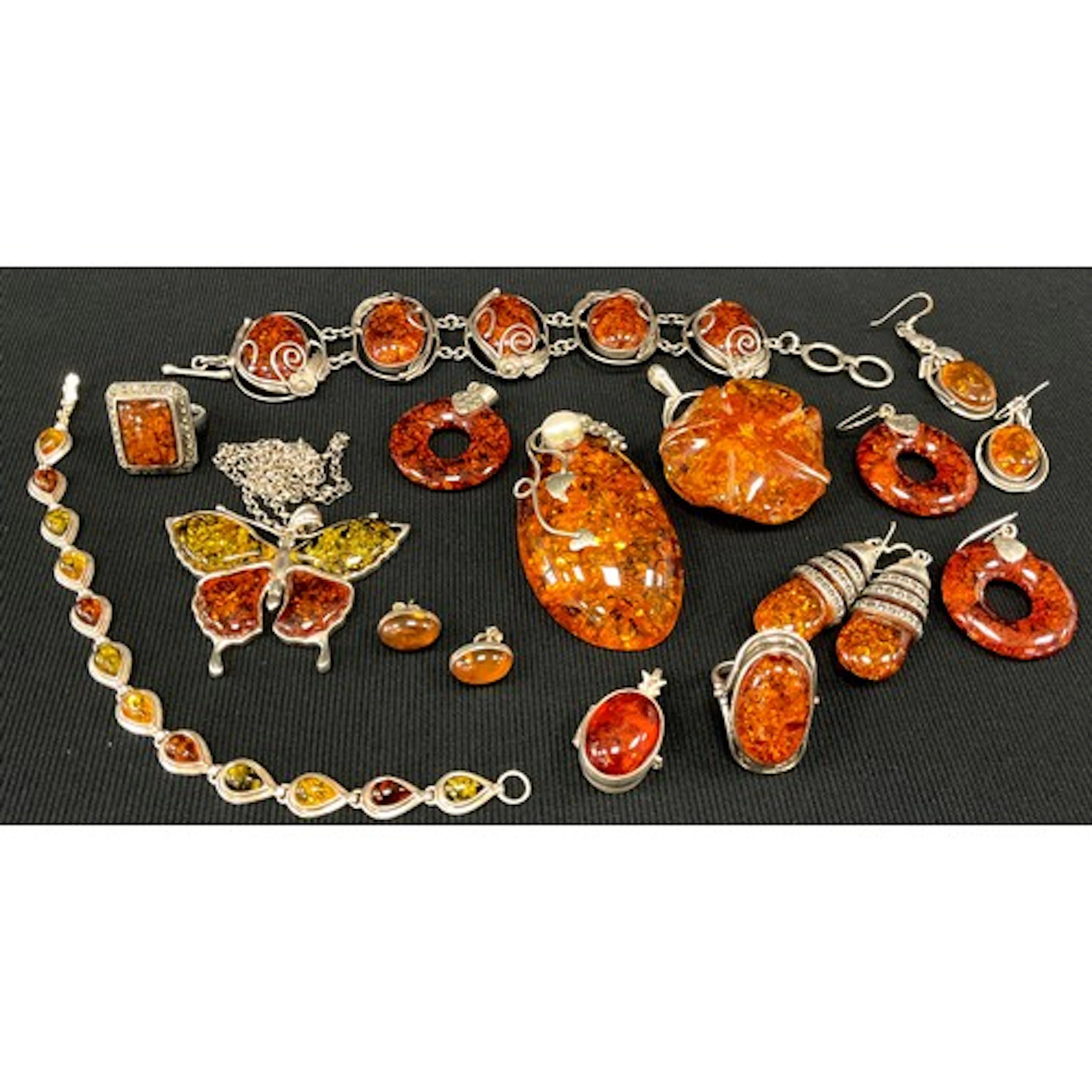 A silver and amber coloured resin five panel cabochon bracel...