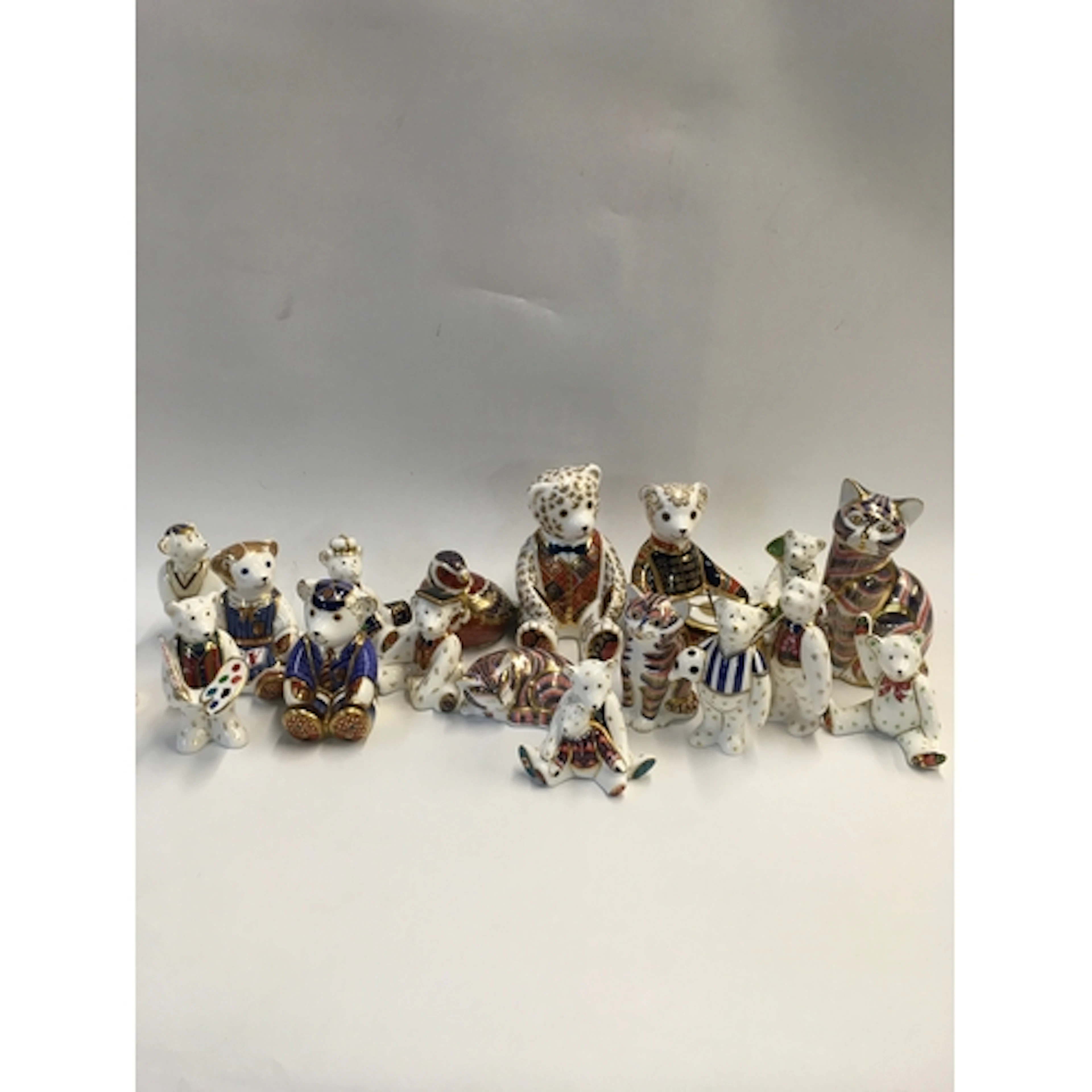 A collection of normal, gold, and silver button Royal Crown ...