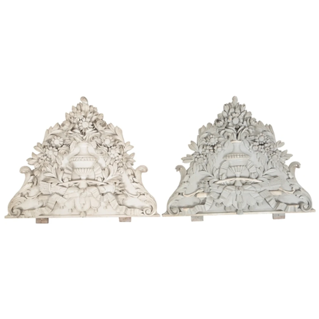 A pair of French painted and carved pine wall appliques, lat...