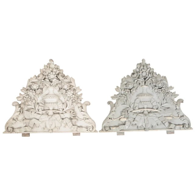 A pair of French painted and carved pine wall appliques, lat...