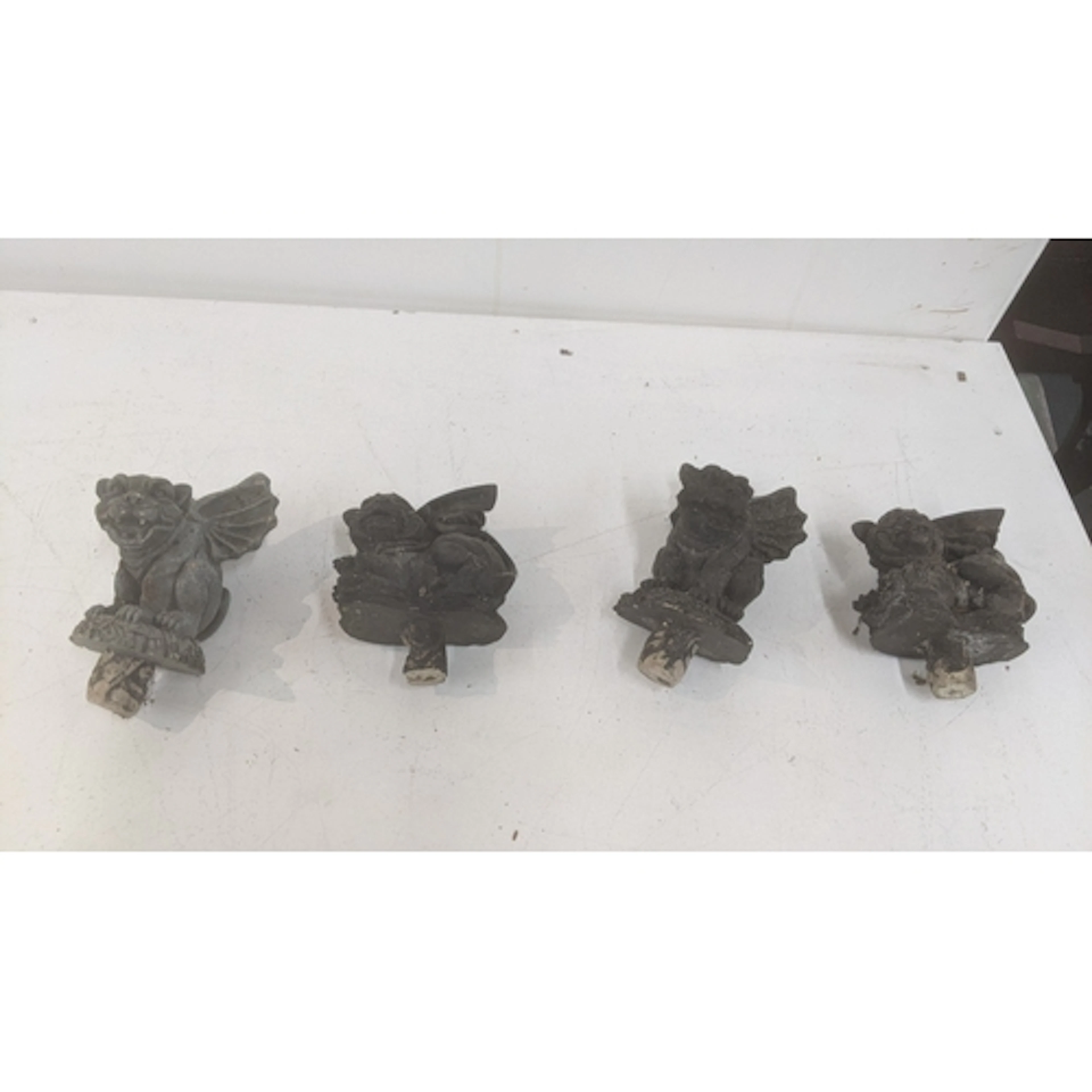 Four Gothic revival grotesque gargoyle ornaments each on int...