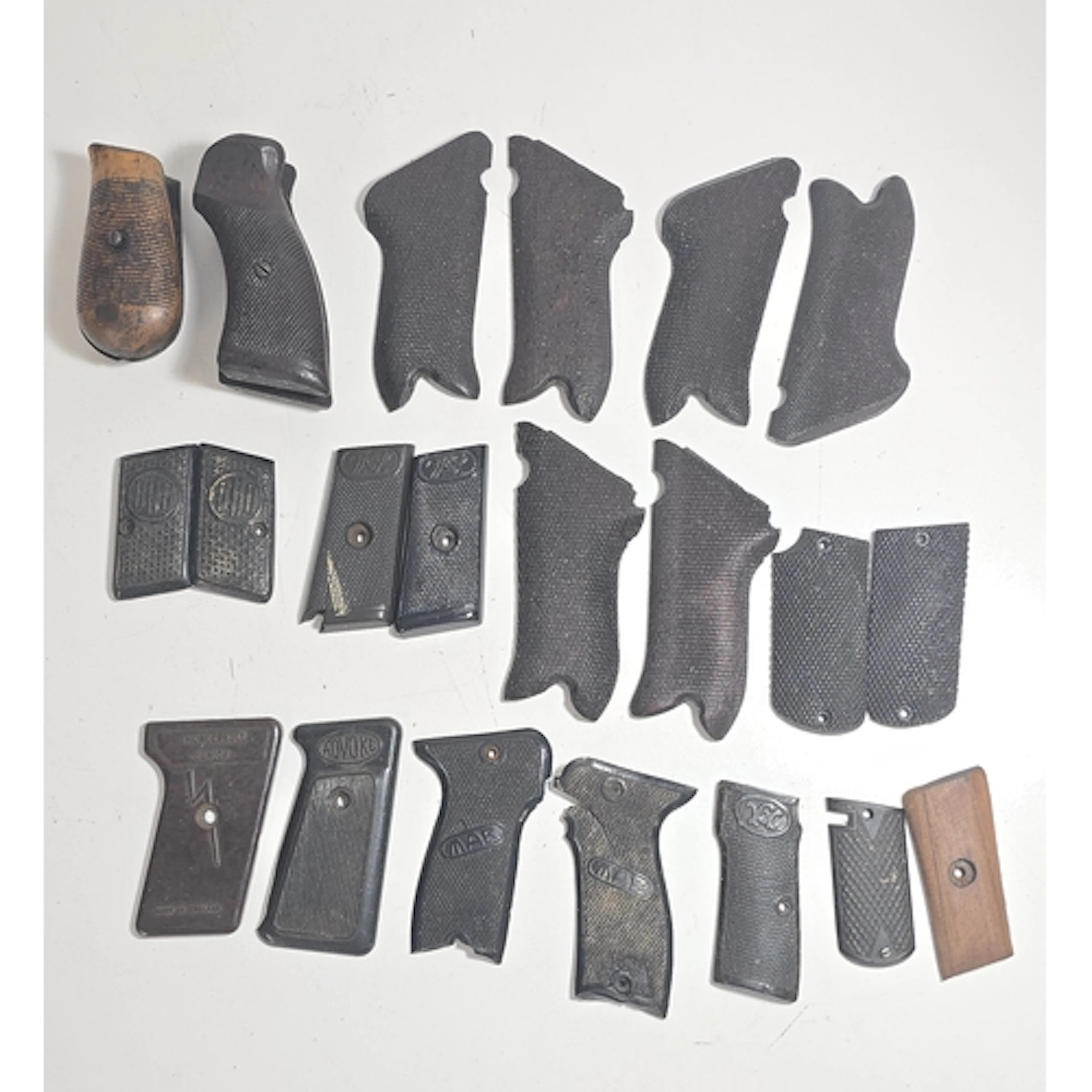 19 various Automatic Pistol grips, including three pairs of ...