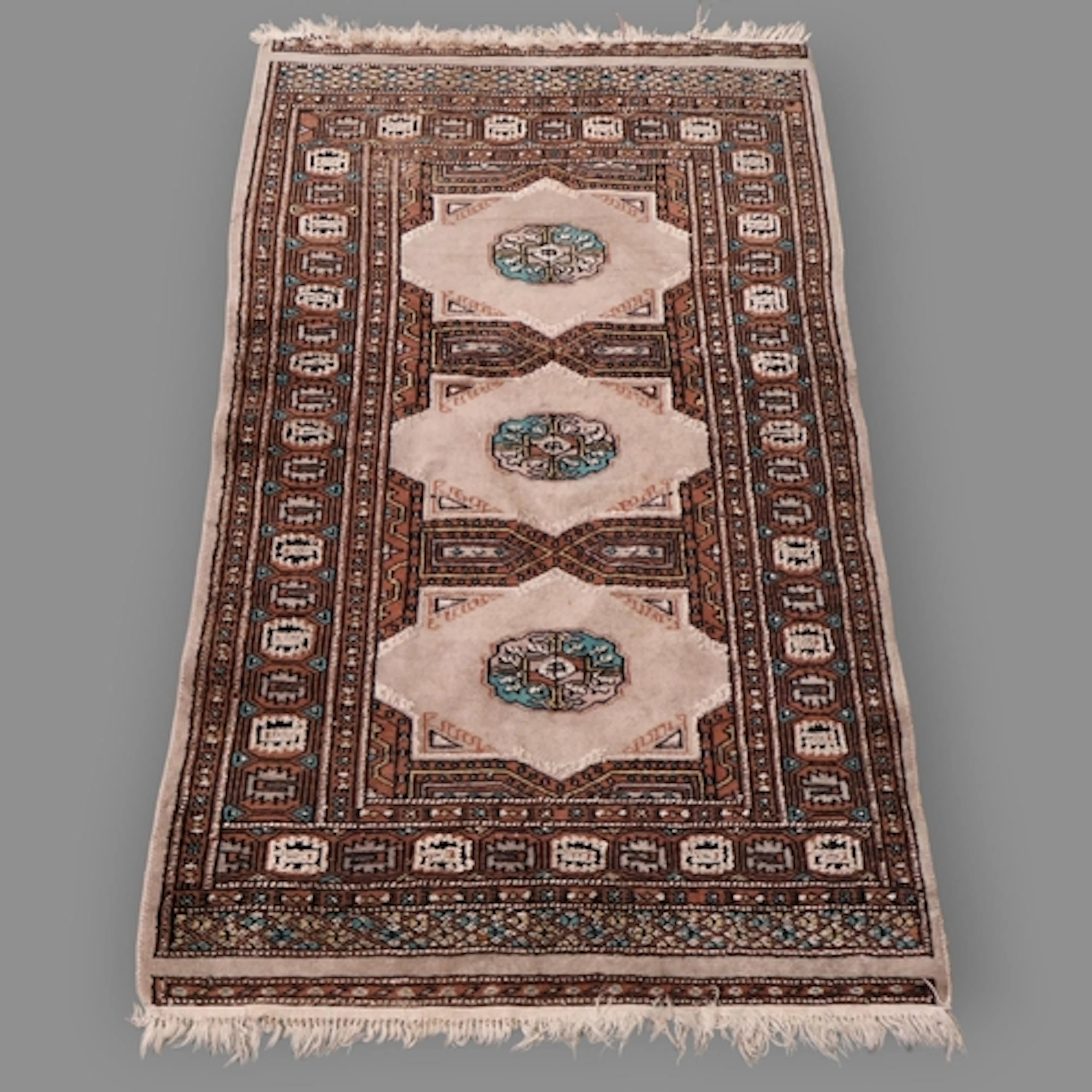 A cream ground Persian rug. L129cm, W78cm.