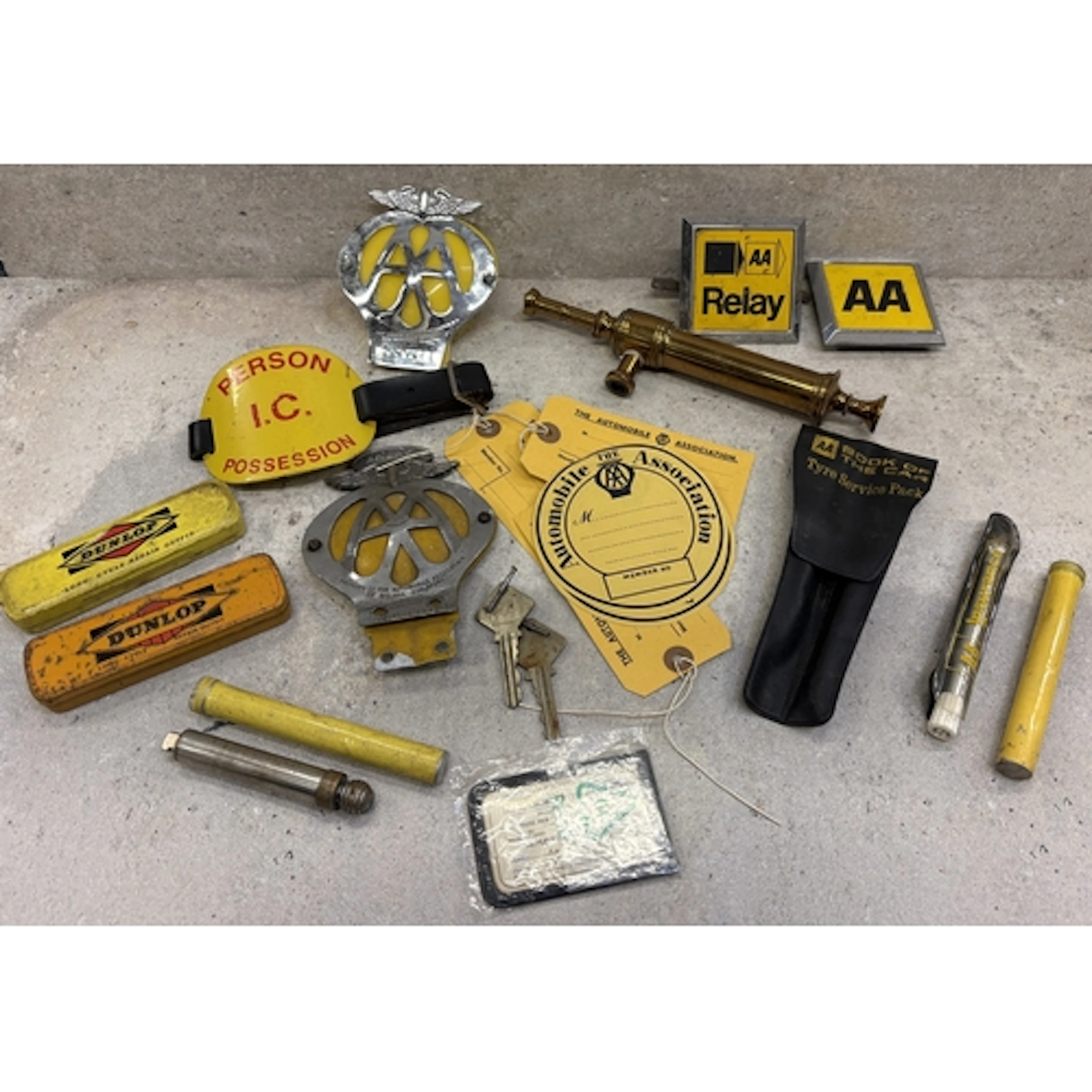 A collection of AA memorabilia to include badges, luggage la...