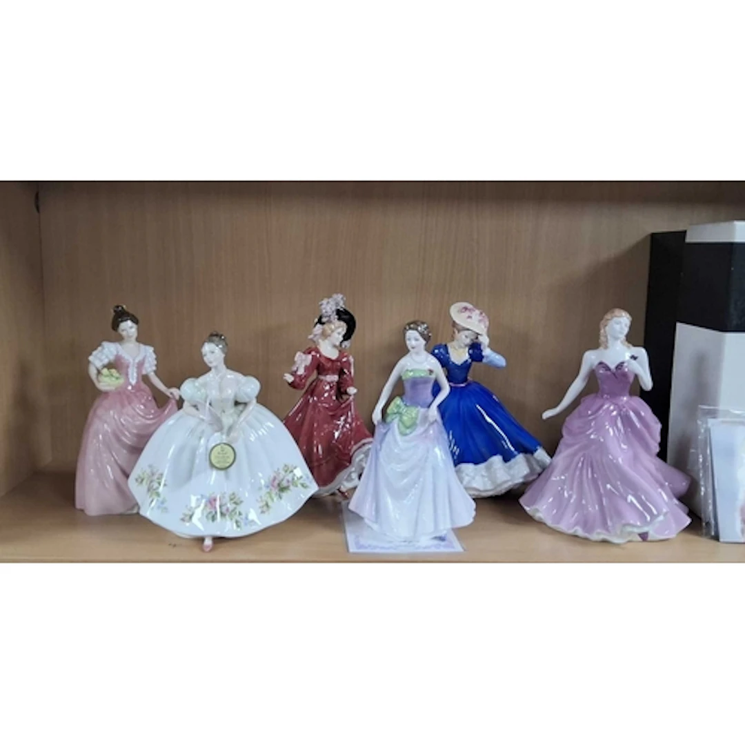 A GROUP OF SIX ROYAL DOULTON LADY FIGURINES, comprising 'Vic...